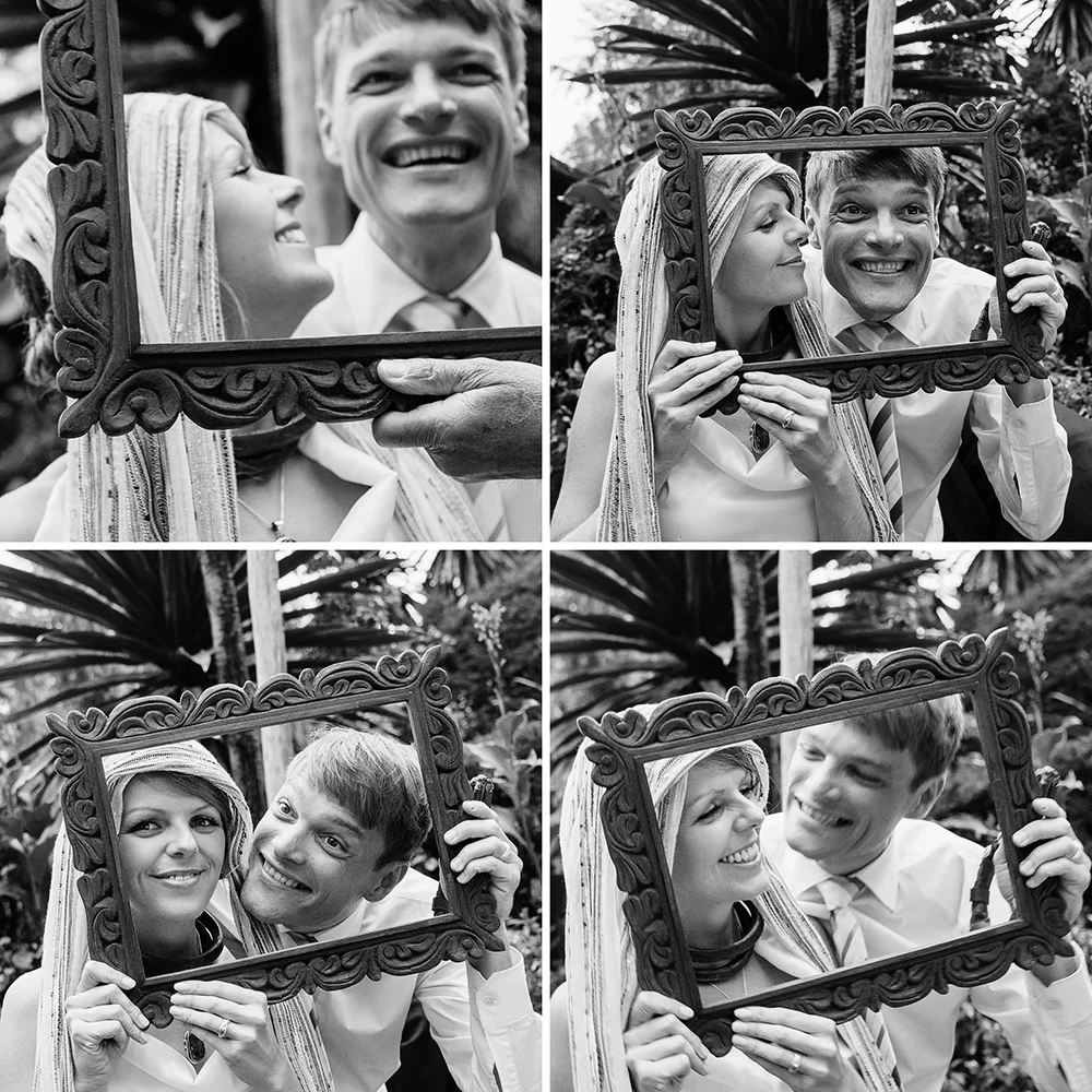 Bride and groom posing with a ceremonial frame by Arcata, California wedding and portrait photographer Kate Donaldson Photography