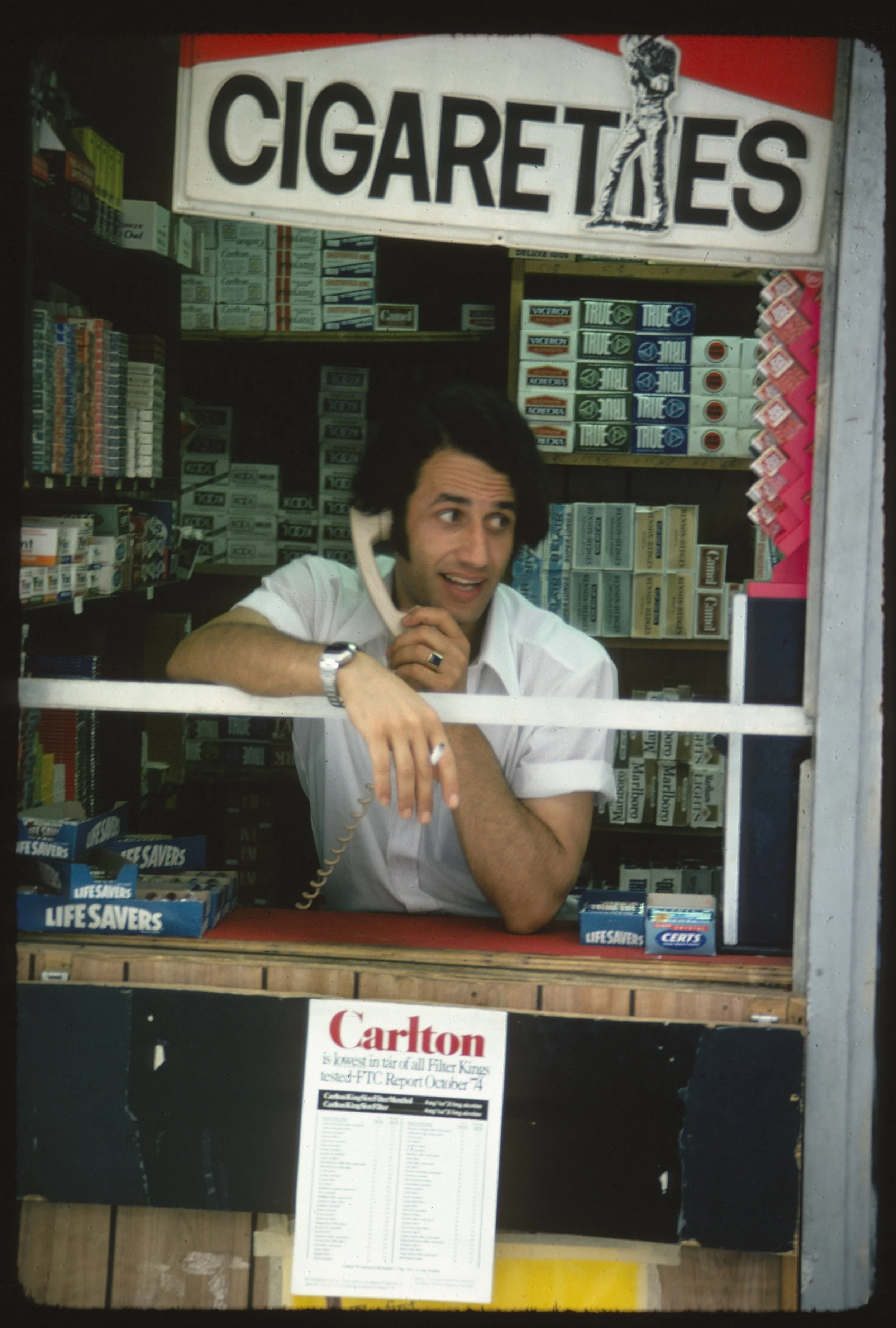 20250816 NYC October #17 Cigarete seller June 1975 3 people 1976 Feb copy - Douglas Healey.jpg