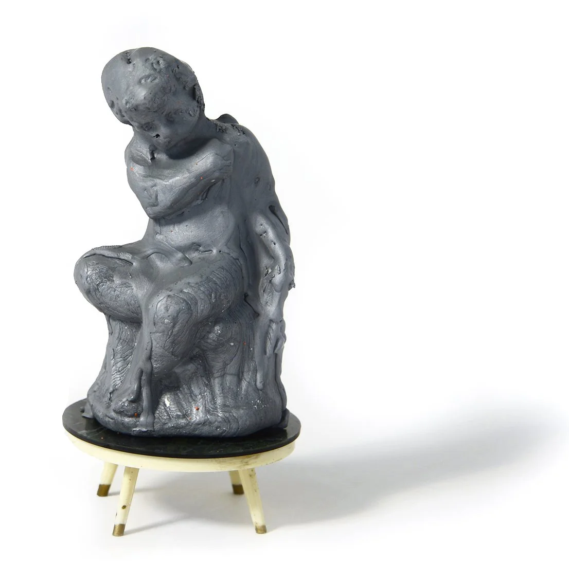 Cherub, 2020 (wax and miniature table)