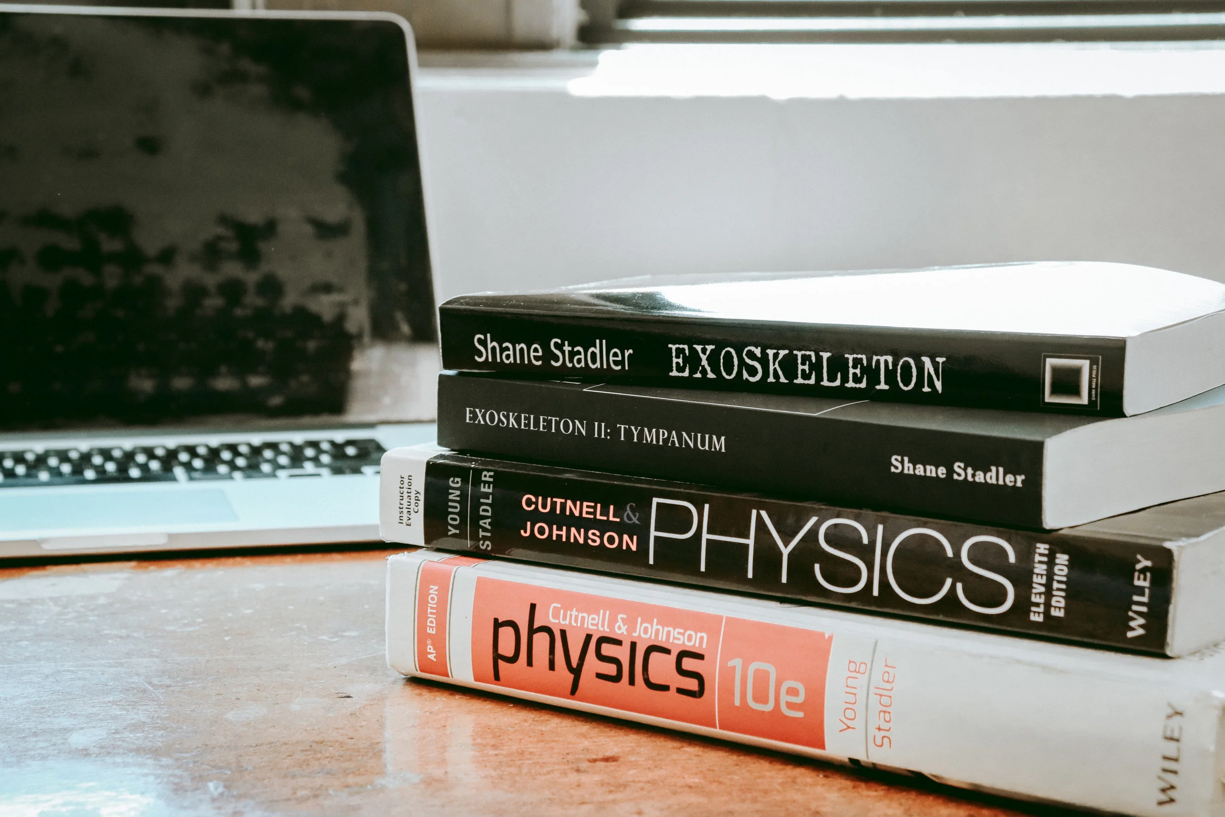 Beyond the books in his “Exoskeleton” series, Shane Stadler has frequently been the author of physics textbooks. Credit: Jessica Manafi