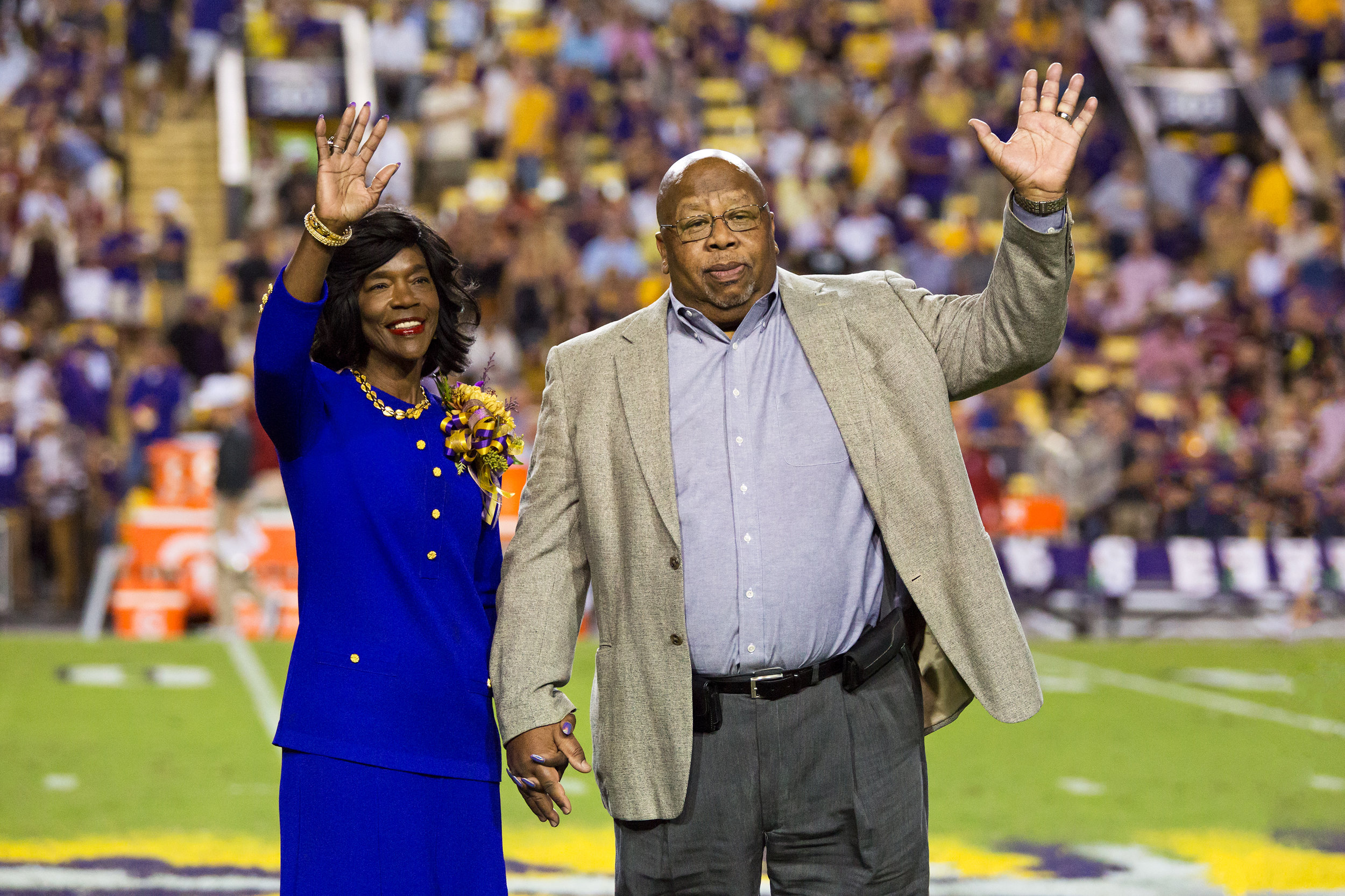 Dr. and Mrs. Warner on the field during halftime of an LSU football game when he was being recognized for his 2016 SEC Professor of the Year award. Credit: LSU