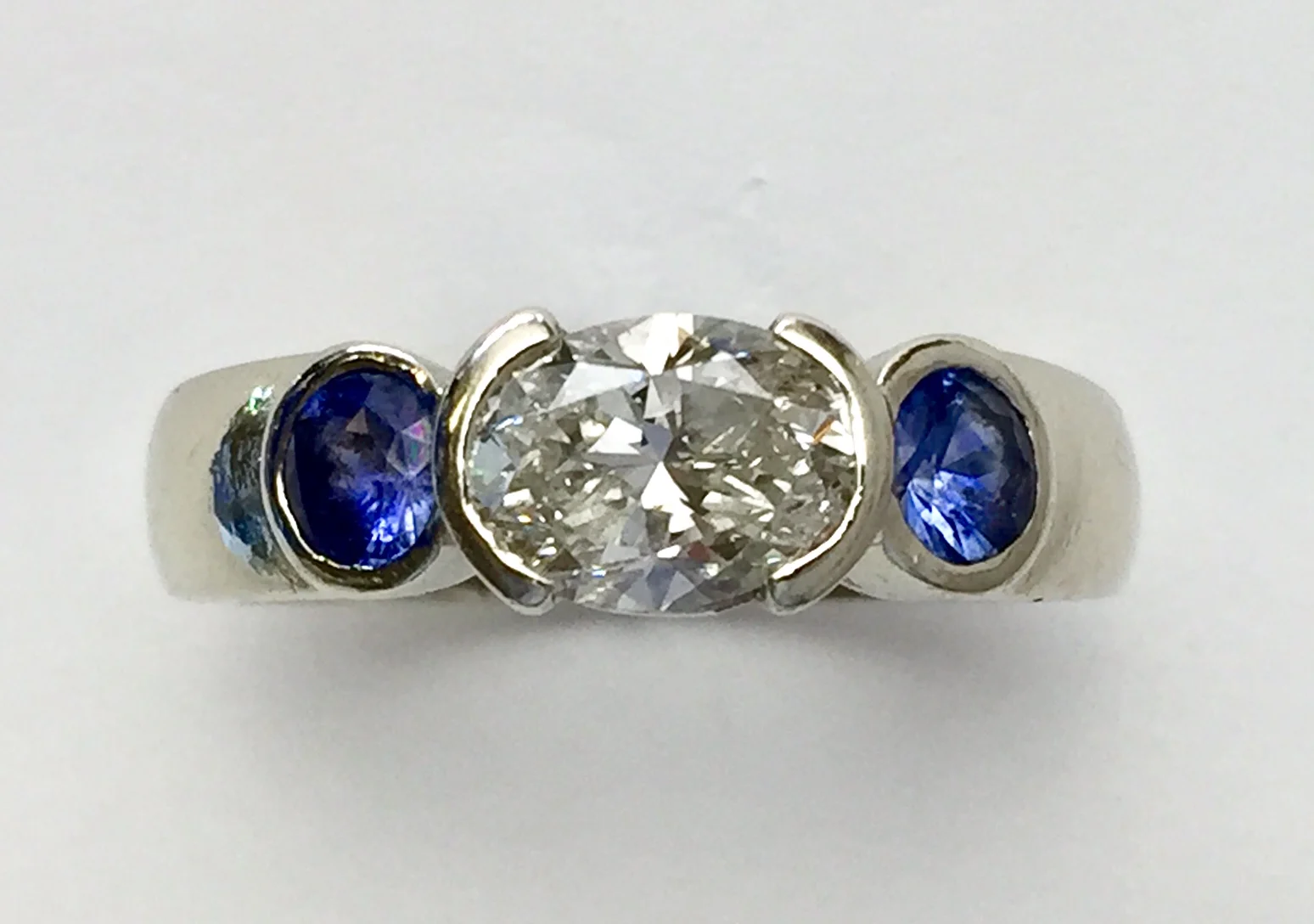 Another conversion of an oval diamond engagement ring to everyday ring, with a splash of color!