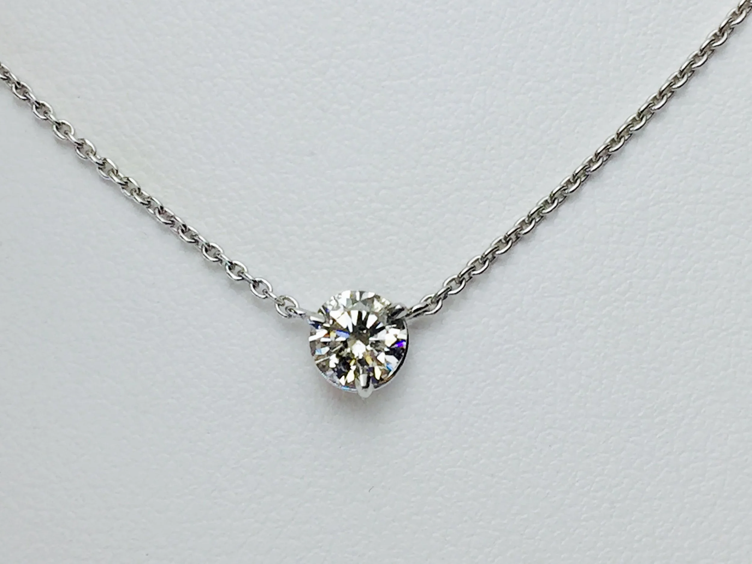 Three prongs and no bezel turn this diamond into a simply sparkling necklace!