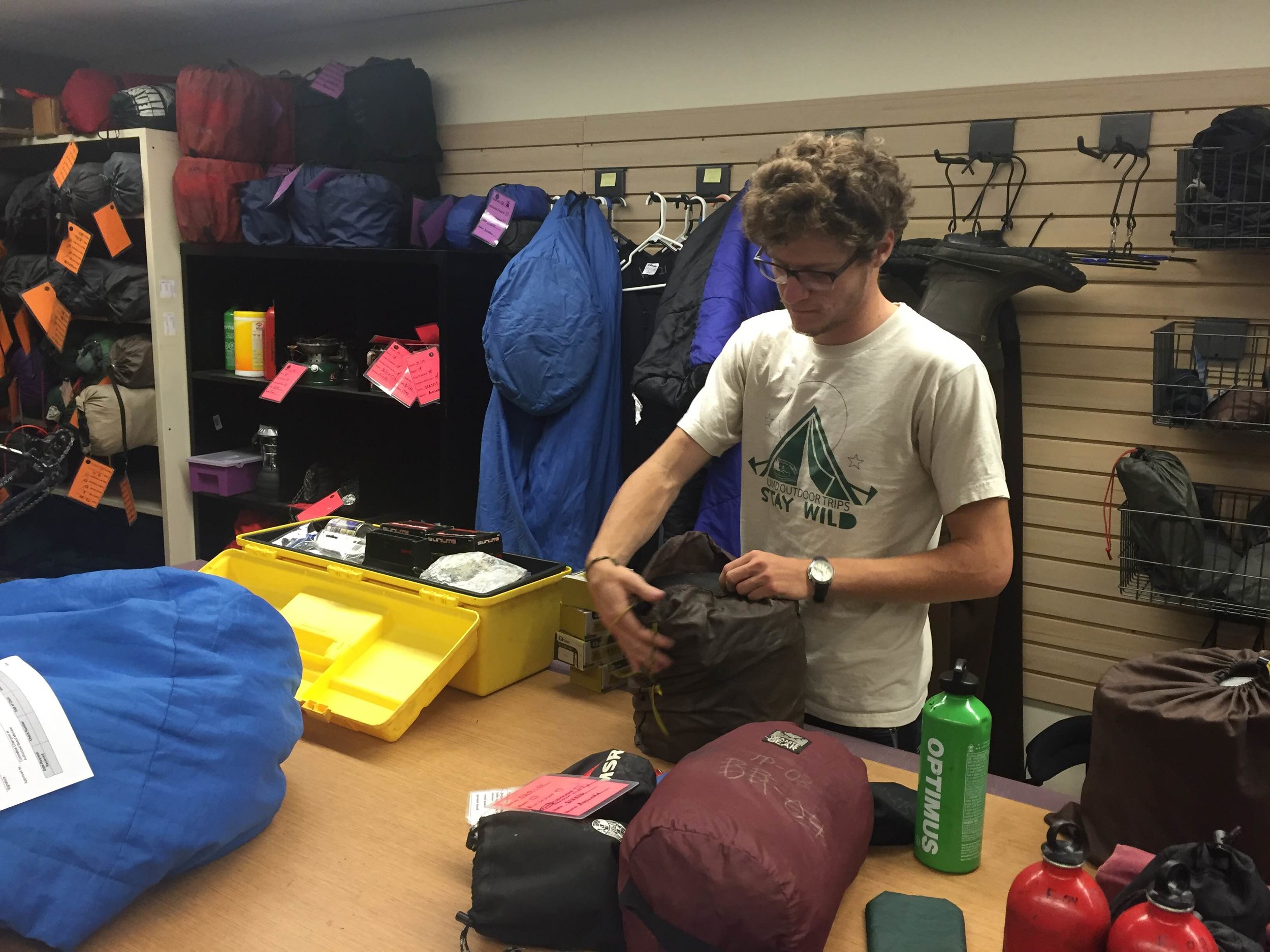 UMD Rental Center staff member Max Whitson unpacks, checks and repacks camping equipment for standard maintenance