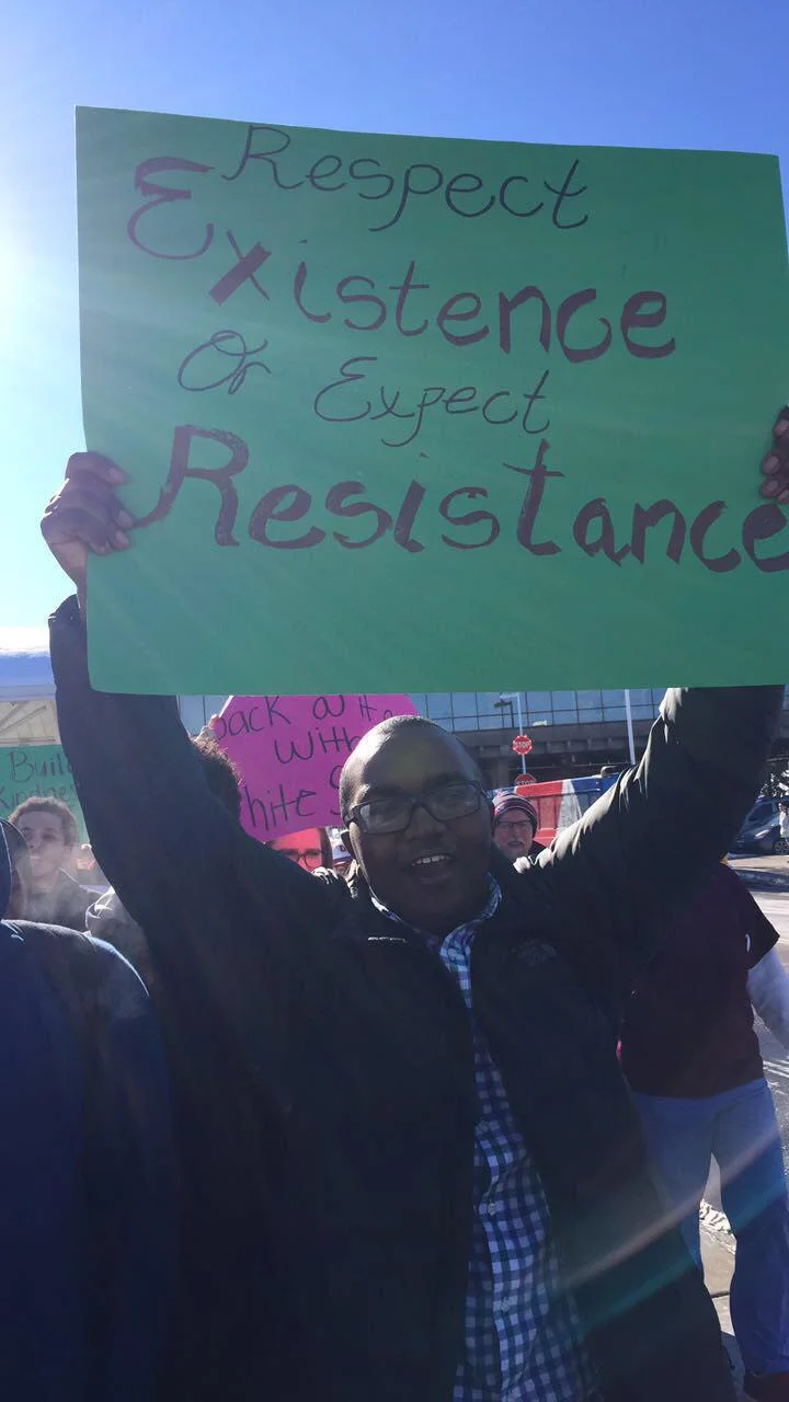 Wesley Osumo, a sophomore at the University of Minnesota Duluth, joins multiple protesters near the bus hub on campus this afternoon.