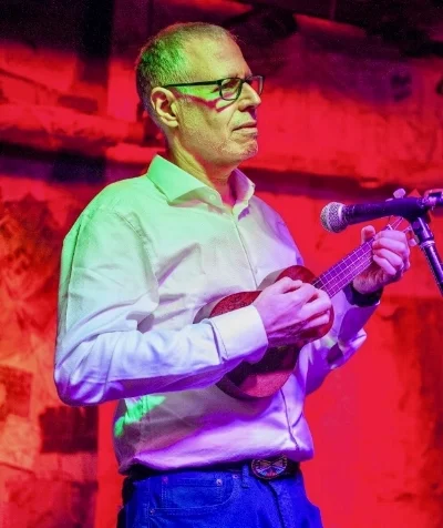 Mahogany Ukulele donated by the Kala Ukulele Company, signed by award-winning uke player, songwriter and composer Nellie McKay. Her music has been used in Mad Men, Grey’s Anatomy, and Weeds, among others. MC Charlie Allenson demonstrated the uke by playing WIld Thing. Never had a lesson.