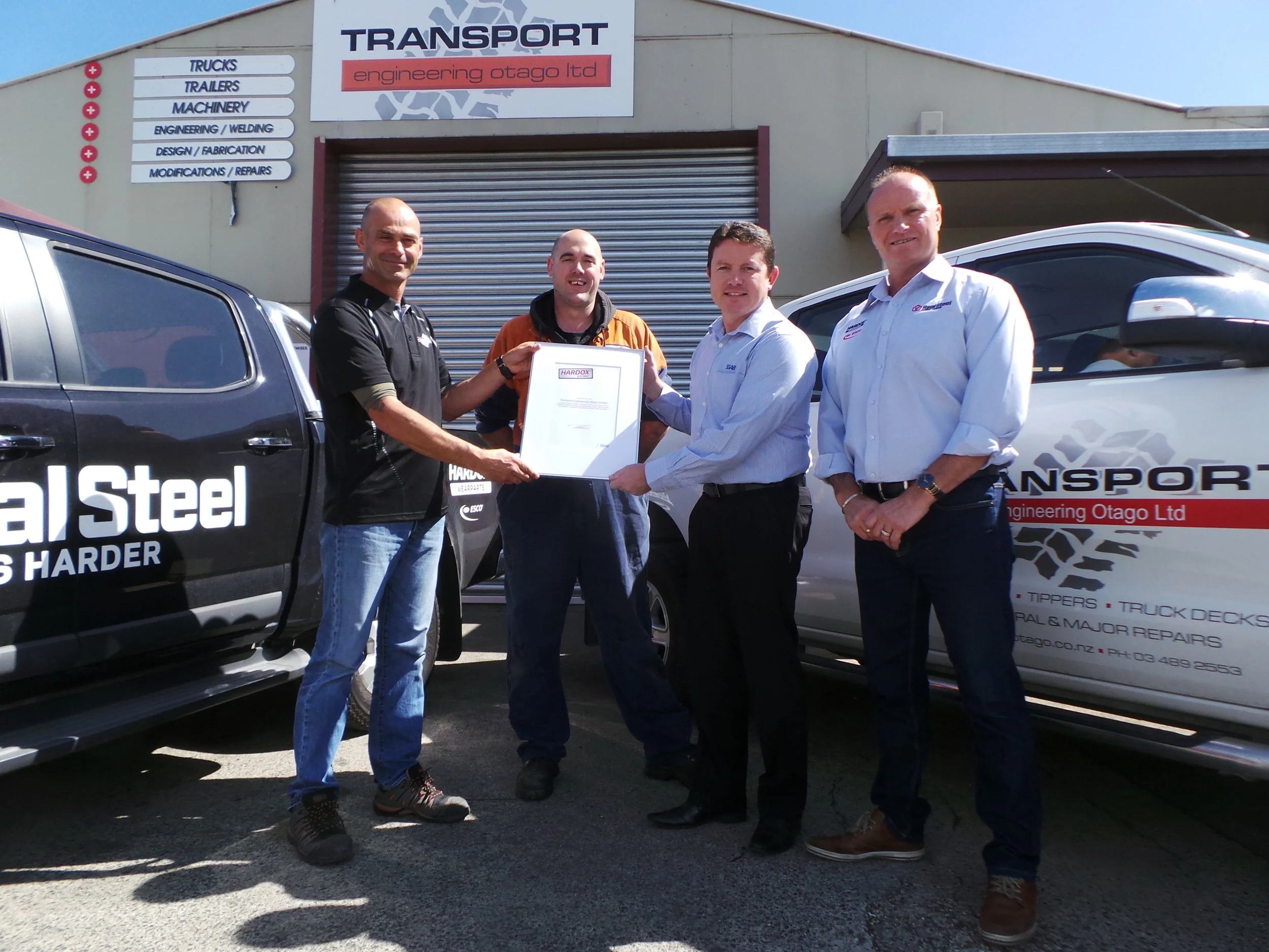 Hardox In My Body accreditation is officially awarded to TEO. Left–right: TEO's Richard Swale, TEO's Daniel Timney, SSAB's Stuart Sephton, Real Steel's Dean Aitken.