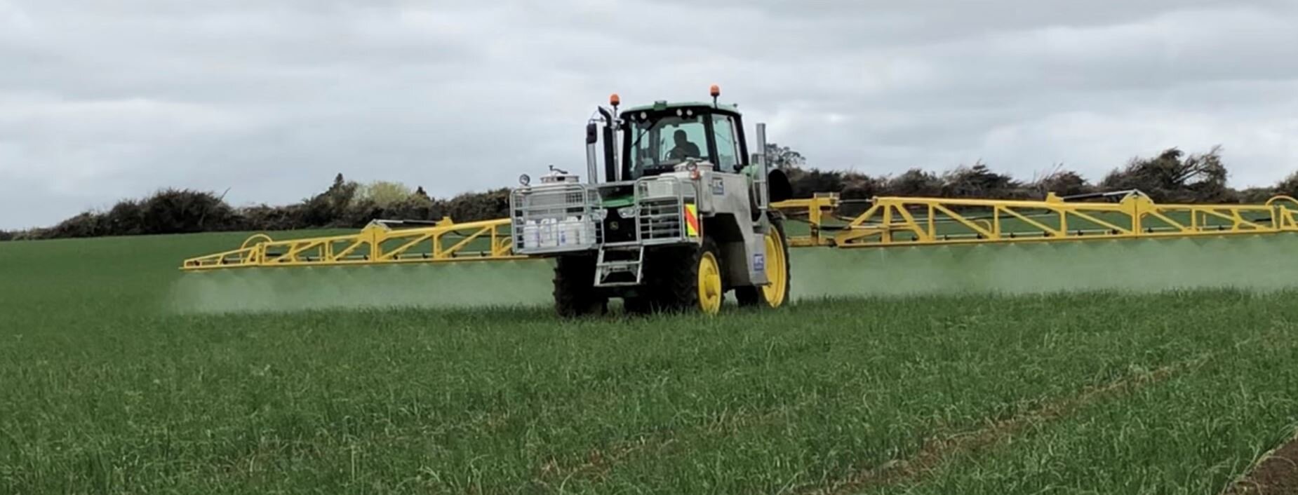 Spray boom in the field.JPG