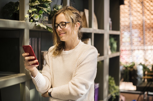 person using social media while working