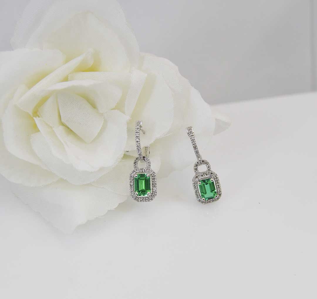 $1500 lab created emeralds set in diamond setting.jpg
