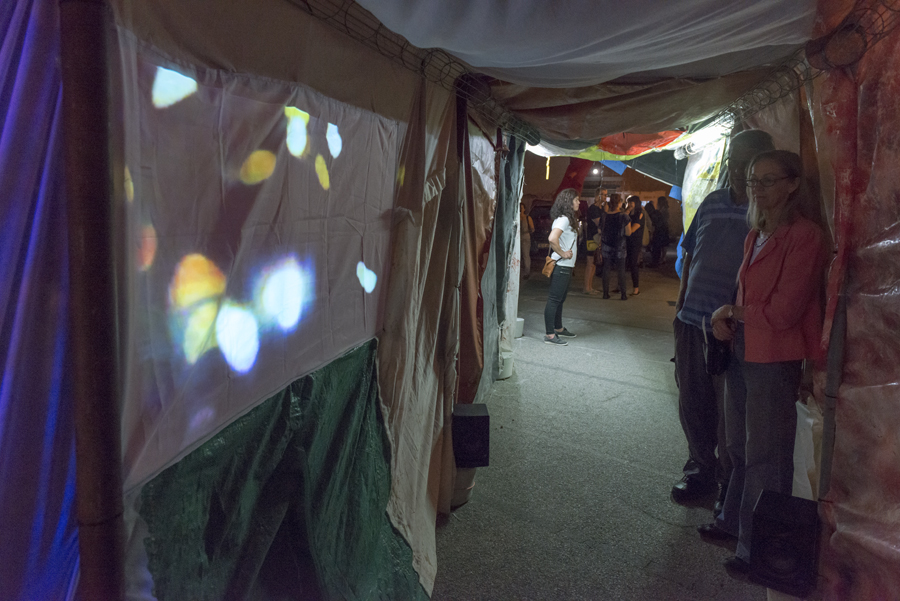   Slushbox , tunnel made from salvaged fabrics, Neil Aldum, Erin Coates and Simone Johnston.  Undergo , video projection inside tunnel, Loren Holmes. Photography: Yvonne Doherty 