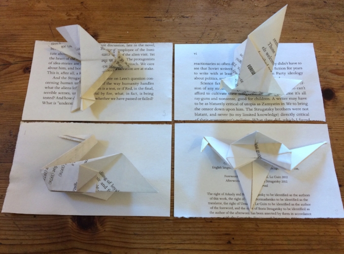 Interlope is a project which involves turning each of the 210 pages from Boris and Arkady Strugatski's Science fiction novel 'Roadside Picnic' in to an origami bird. An exercise in both digesting the text and origami incompetence. In the book, Red a 'Stalker' ventures illegally into a 'zone' to collect artefacts and debris left by an unknown ecological disaster or alien visitation – the location is an undisclosed but is widely assumed to be Russia. Parts of the narrative can be glimpsed on the folded sections of the birds and the small square of paper left behind after making them. this work develops ideas of language and silence, borders and boundaries and the complicated systems of propaganda at work in creating fables both in celebration of the soviet Empire and its demise. In 1979 Andrei tarkowski made a film called 'Stalker' based on the narrative of 'Roadside Picnic' developing the concept of the 'Zone'. Tarkowsky was exiled by the Russian government due to the anti-soviet sentiment expressed in his films ( the Zone widely thought to be a critique of the Gulags) and died not long later from a disease widely attributed to the time spent shooting 'Stalker' on toxic wastelands. This work begins to develop these narratives through the small gestures of reading and paper folding, making reference to systems of understanding and knowledge acquisition whilst using the emblem of the bird as conduit.