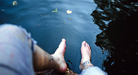 feet dipping in water