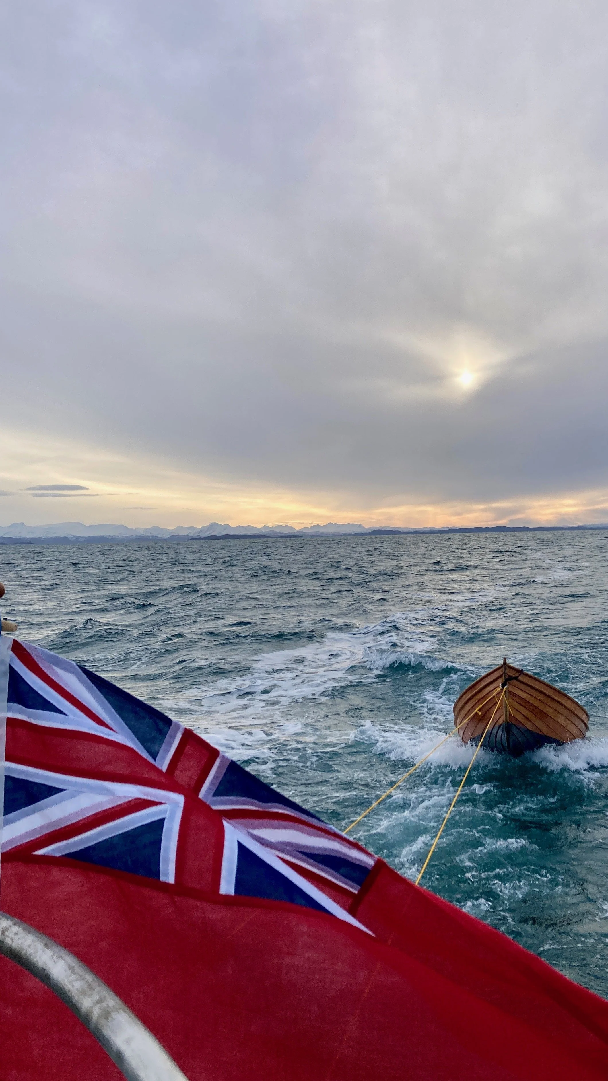 Red Ensign on the retired flagstaff, Johnson & Loftus built tender in tow. Ullapool to Lochinver 10 January 2026
