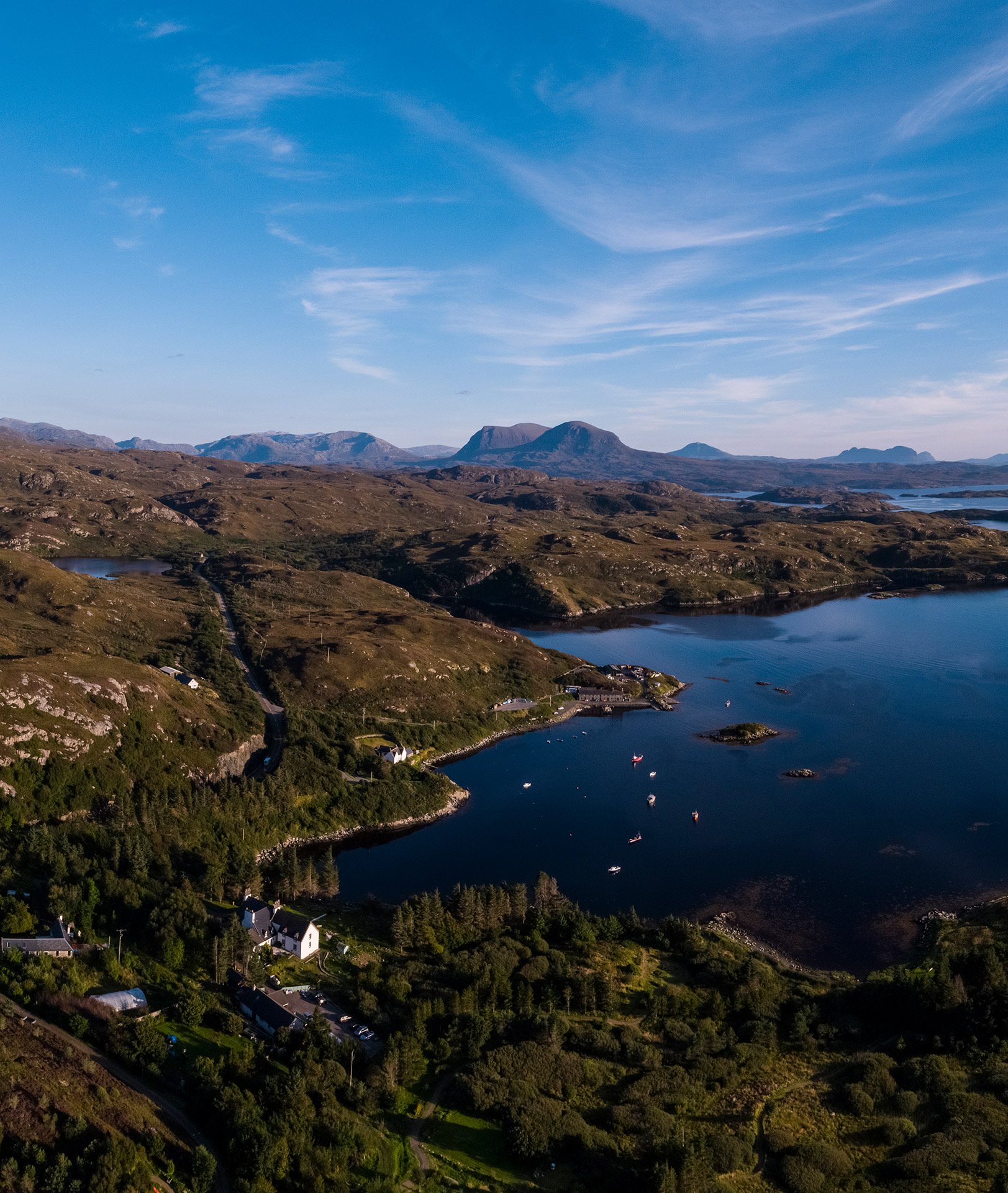 Aerial view of Eddrachilles Hotel overlooking Badcall Bay in the North West Highlands of Scotland.