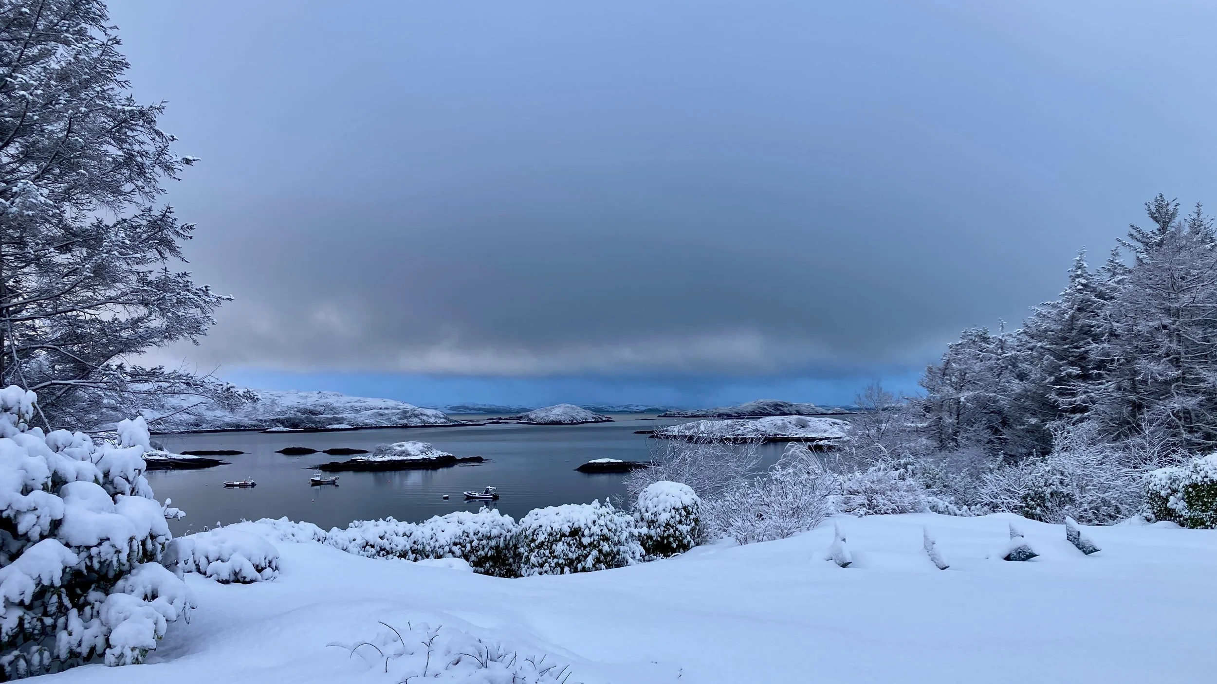 Snow at Eddrachilles Hotel, looking across the front lawn to Badcall Bay, January 2026
