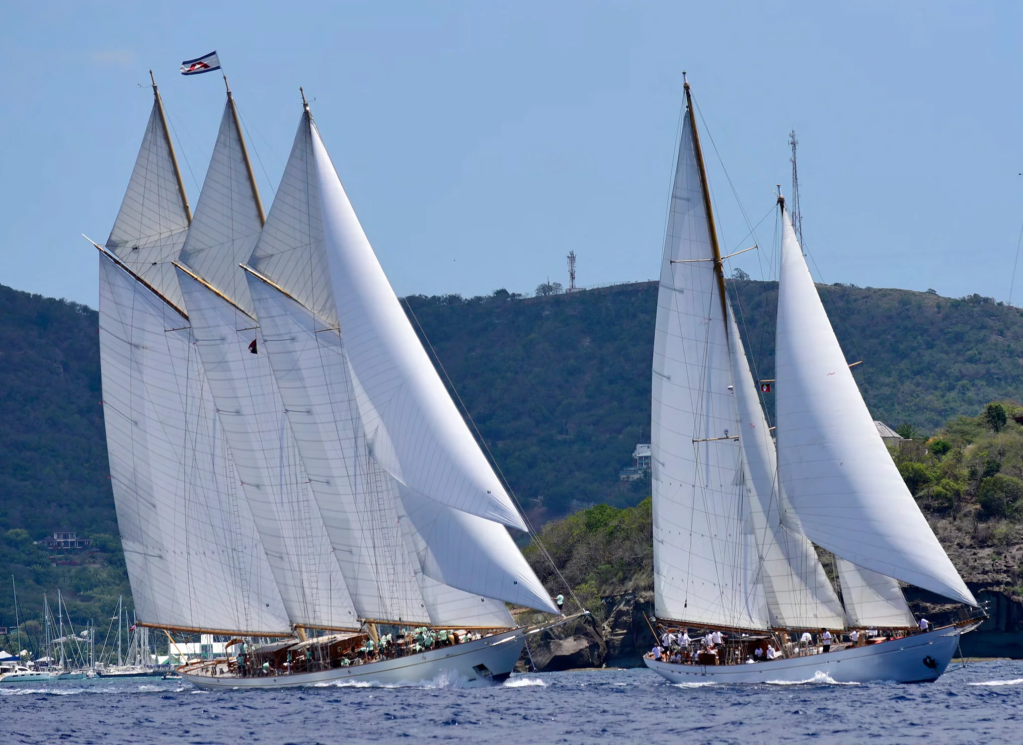 Eros enjoys a thrilling start with 200 ft. three-masted schooner Adix at the Antigua Classic Regatta. Photos by Mark Krasnow.