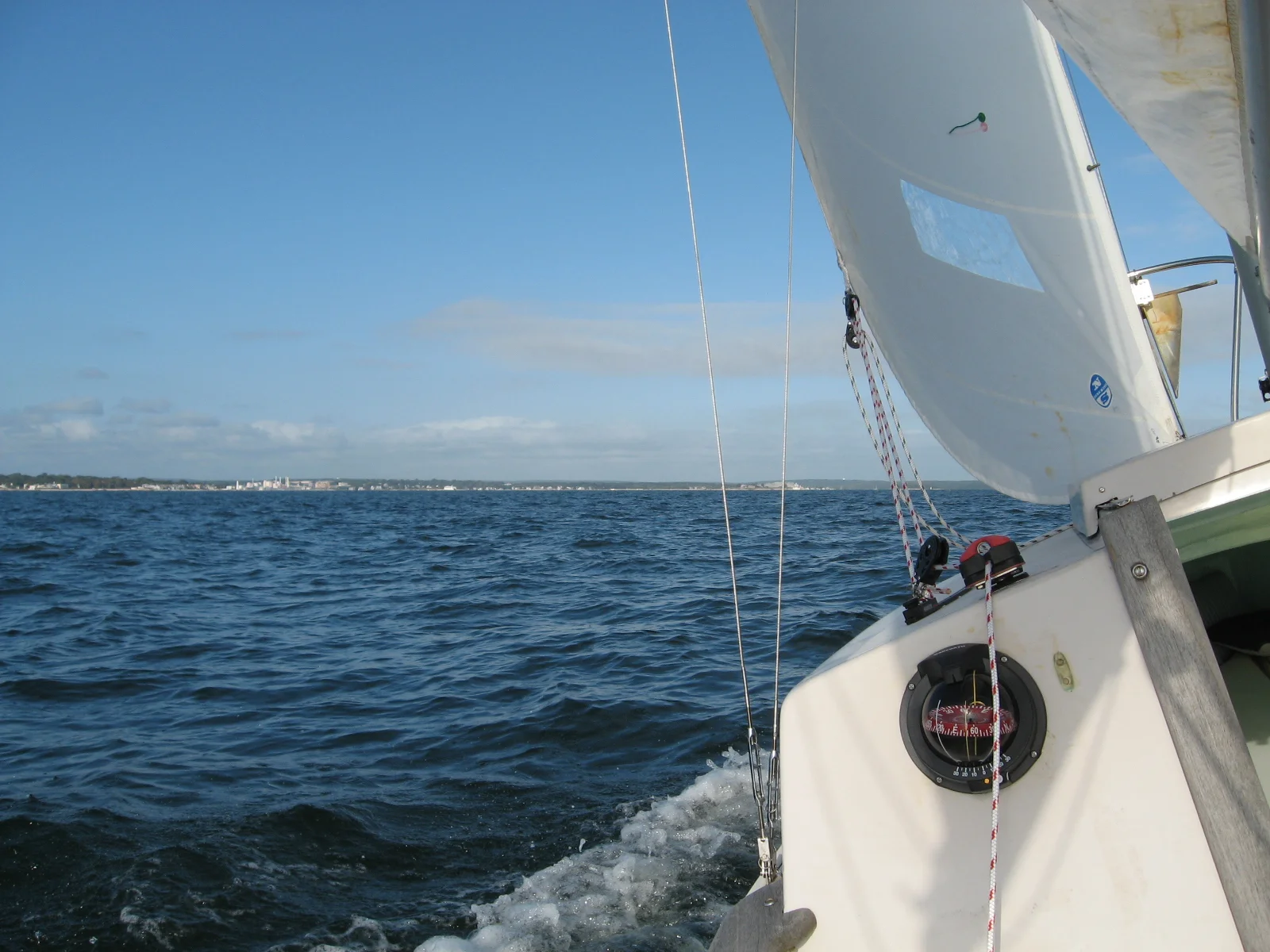  The old compass, original to the boat, was replaced with a new Ritchie. New London harbor is in the background. 