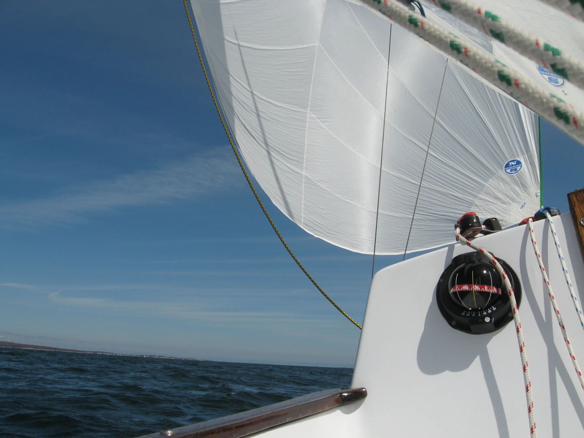 I flew my new asymmetrical spinnaker single-handed - what a thrill! The main and jib combined makes 185 square feet of sail - the a-sail alone is 205.