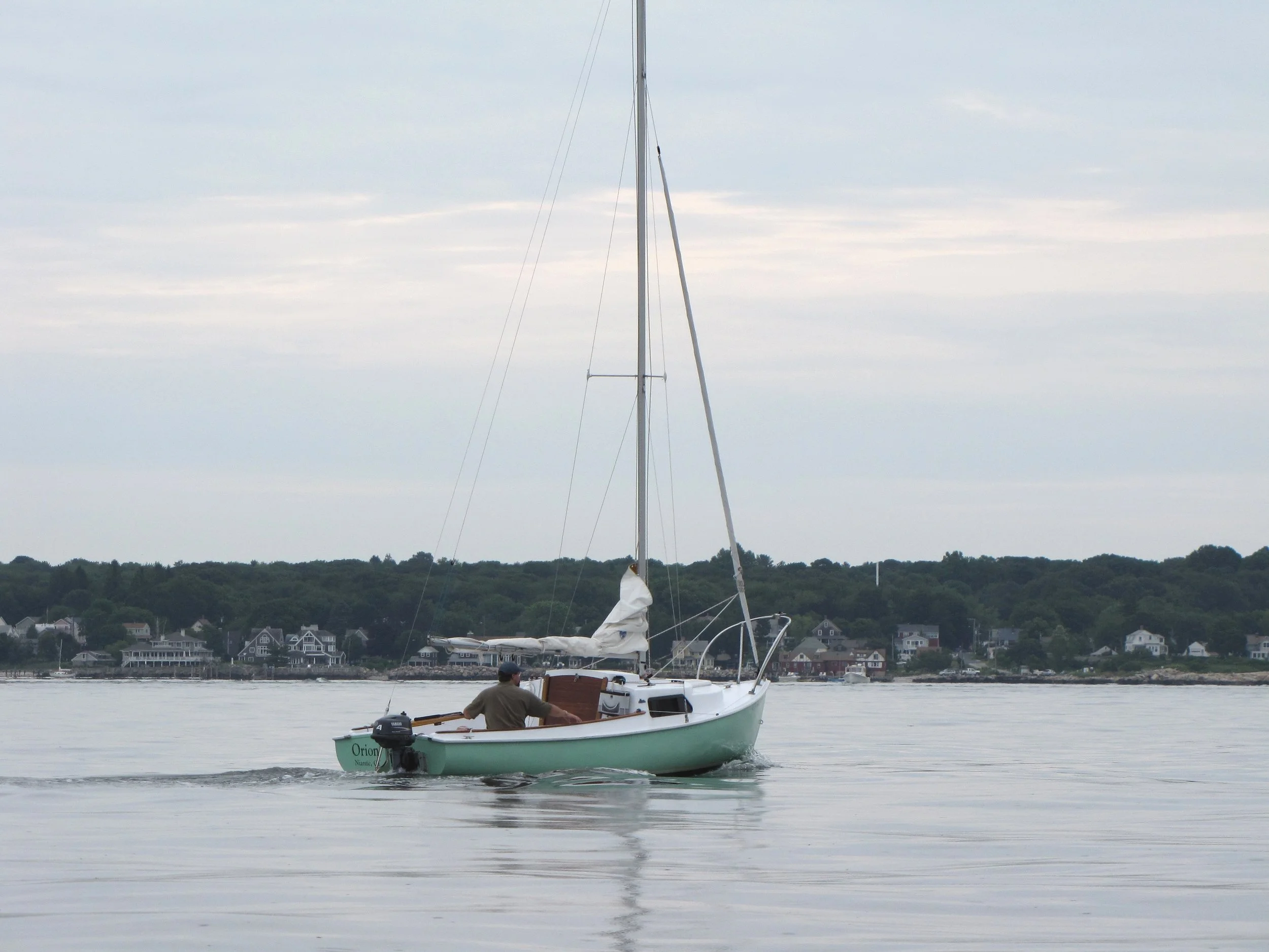  July 23rd: The first day of the Southeast Connecticut Mariner Fleet Rendezvous brought very light winds.&nbsp; Here I am motoring to New London. 