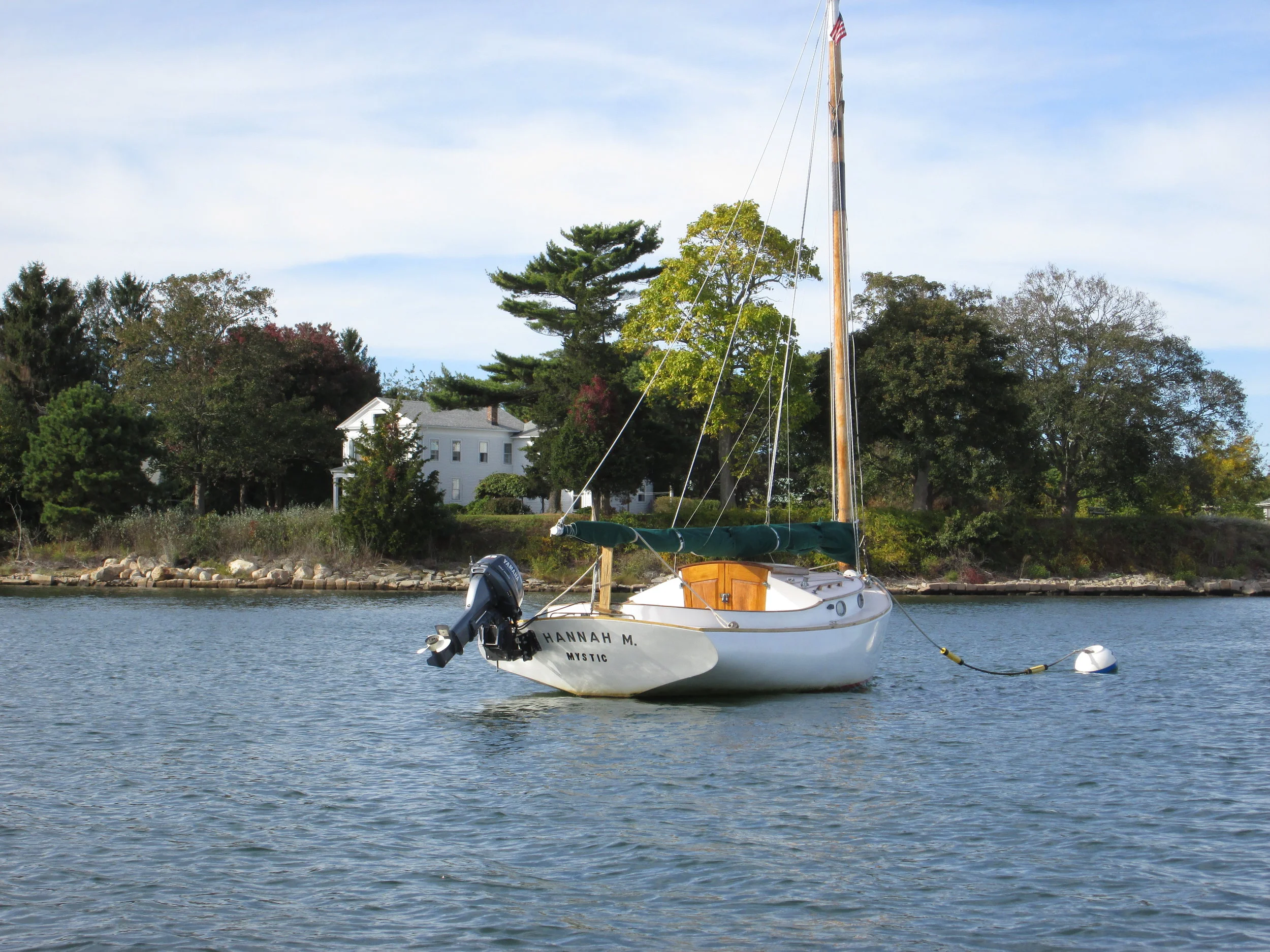  Even the presence of a large outboard motor does not detract from the great lines of this catboat moored off of my parents' house. 