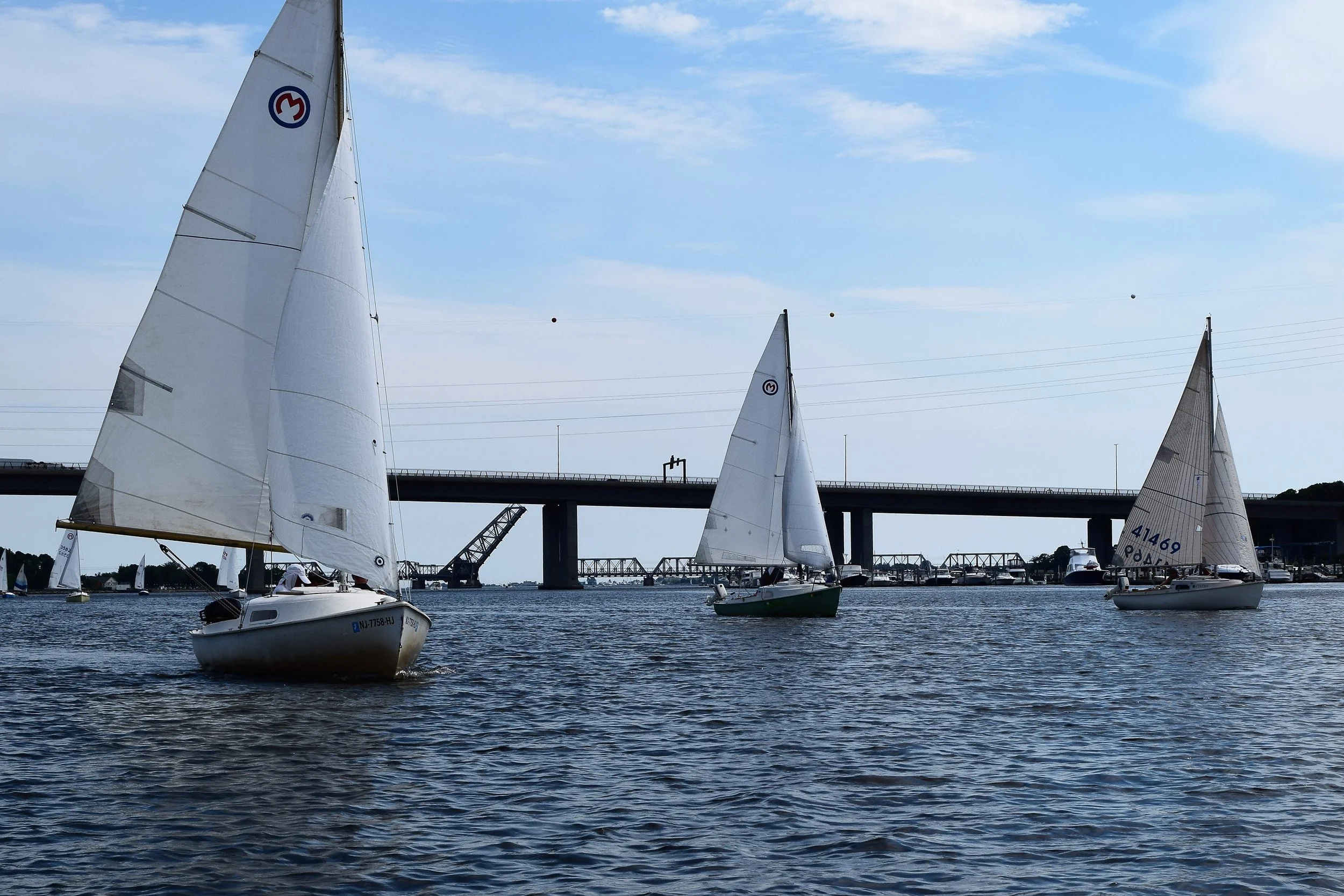 Fifteen Mariners attended the event, sailing westward and up the Connecticut River to Essex. Here are some boats that just passed underneath the I-95 highway bridge. 