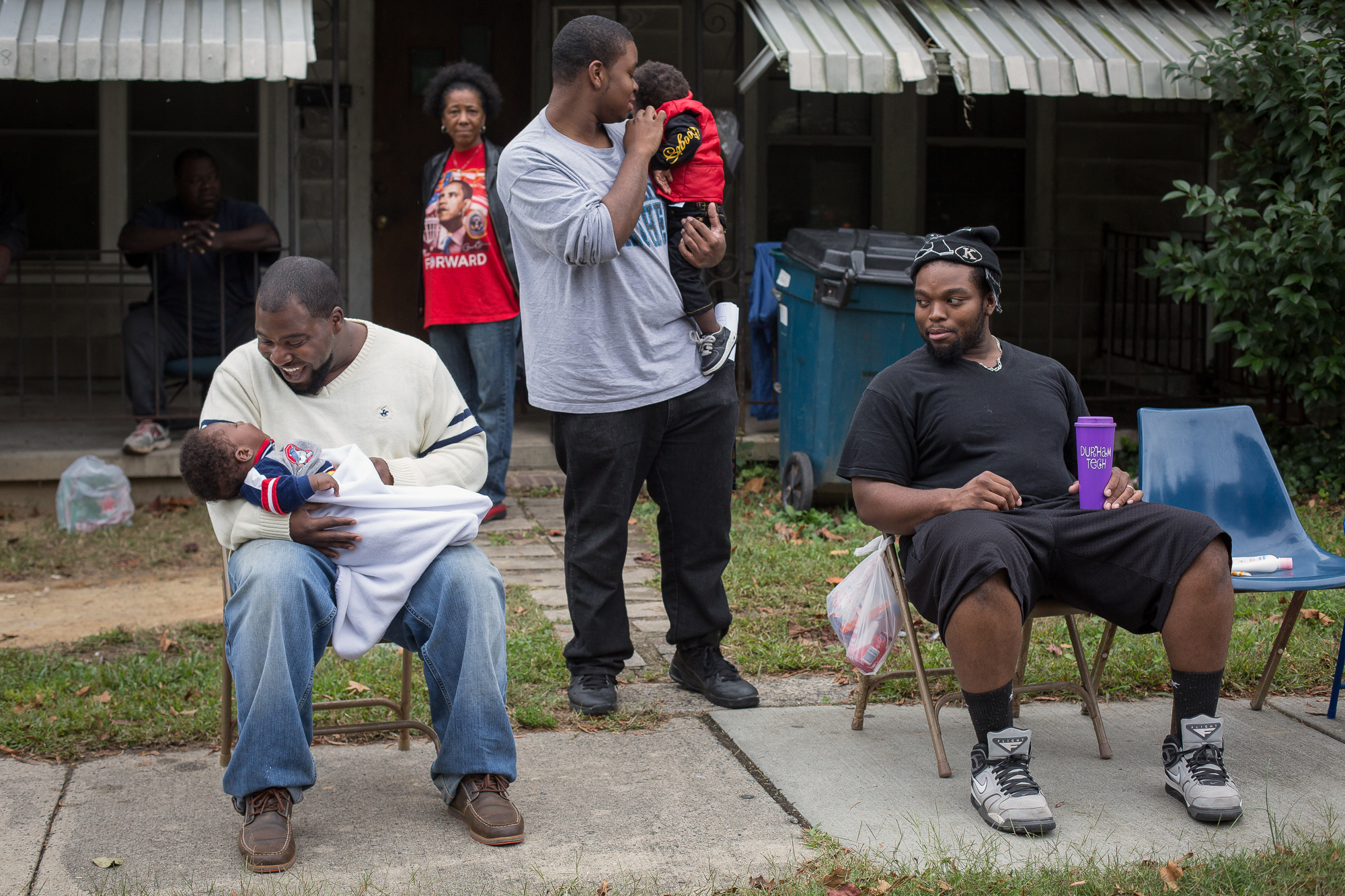  Young men revel along Fayetteville Street during Hillside High School’s homecoming parade. Hillside has a predominantly African-American student population and serves many low-income communities in East and South Durham. According to Durham Public S