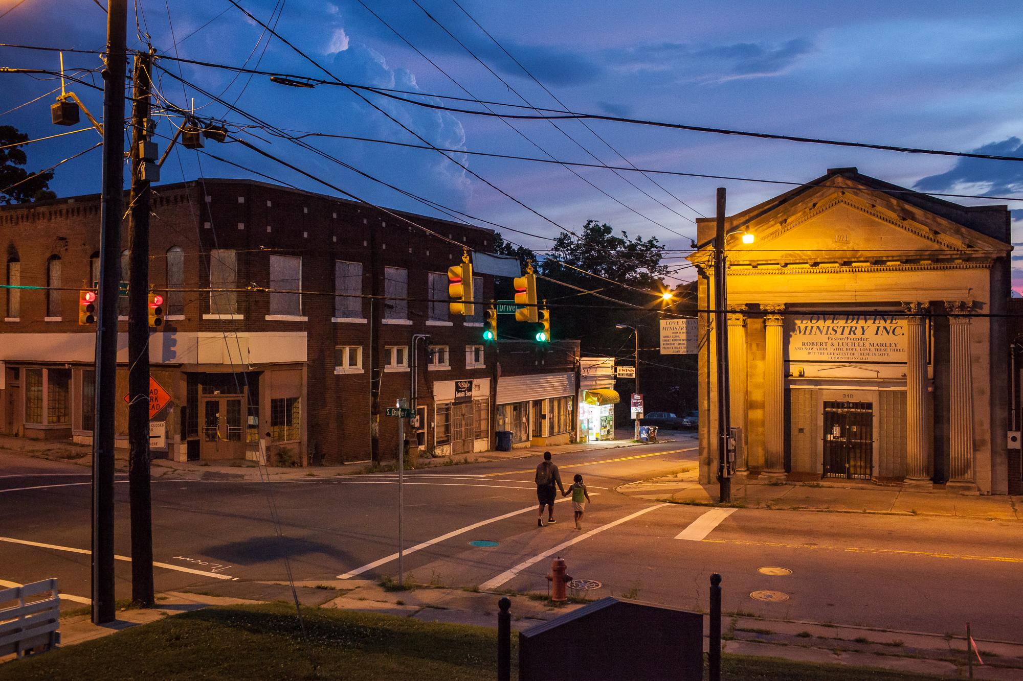  A summer storm rolls in over Angier Avenue and Driver Street in East Durham at sunset. 