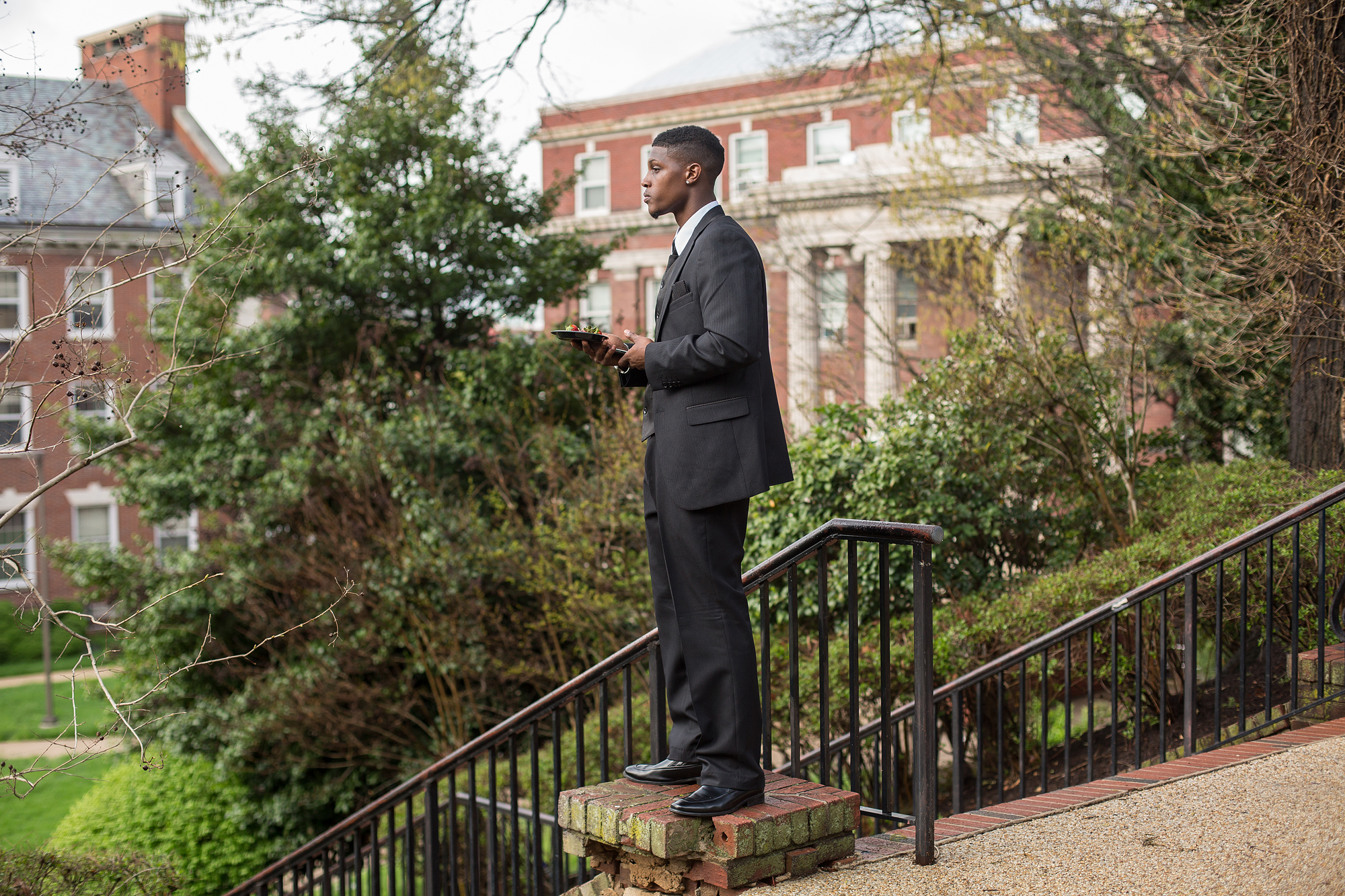  Rashard looks across a quad at Howard University in Washington, D.C. after speaking about his incarceration experience. He dreams of being a motivational speaker, and in 2015 was making steps towards that dream.&nbsp;&nbsp; 