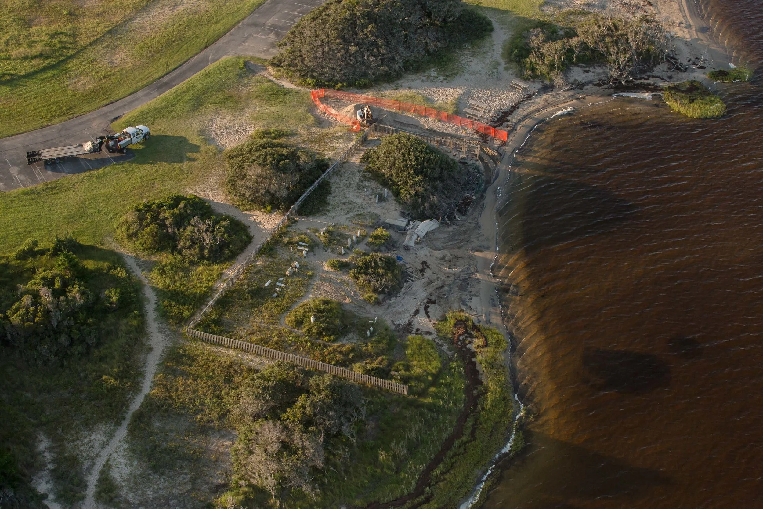 The Salvo Community Cemetery (as seen in September 2017) is bound by the Pamlico Sound and the Salvo Day Use Area. Both lie within the Cape Hatteras National Seashore, which is managed by the National Park Service. But the cemetery is not maintained by the Park Service, it is privately owned by the community, which is scrambling to raise the funds to save it. The next major storms threaten to wash it into the Pamlico Sound.