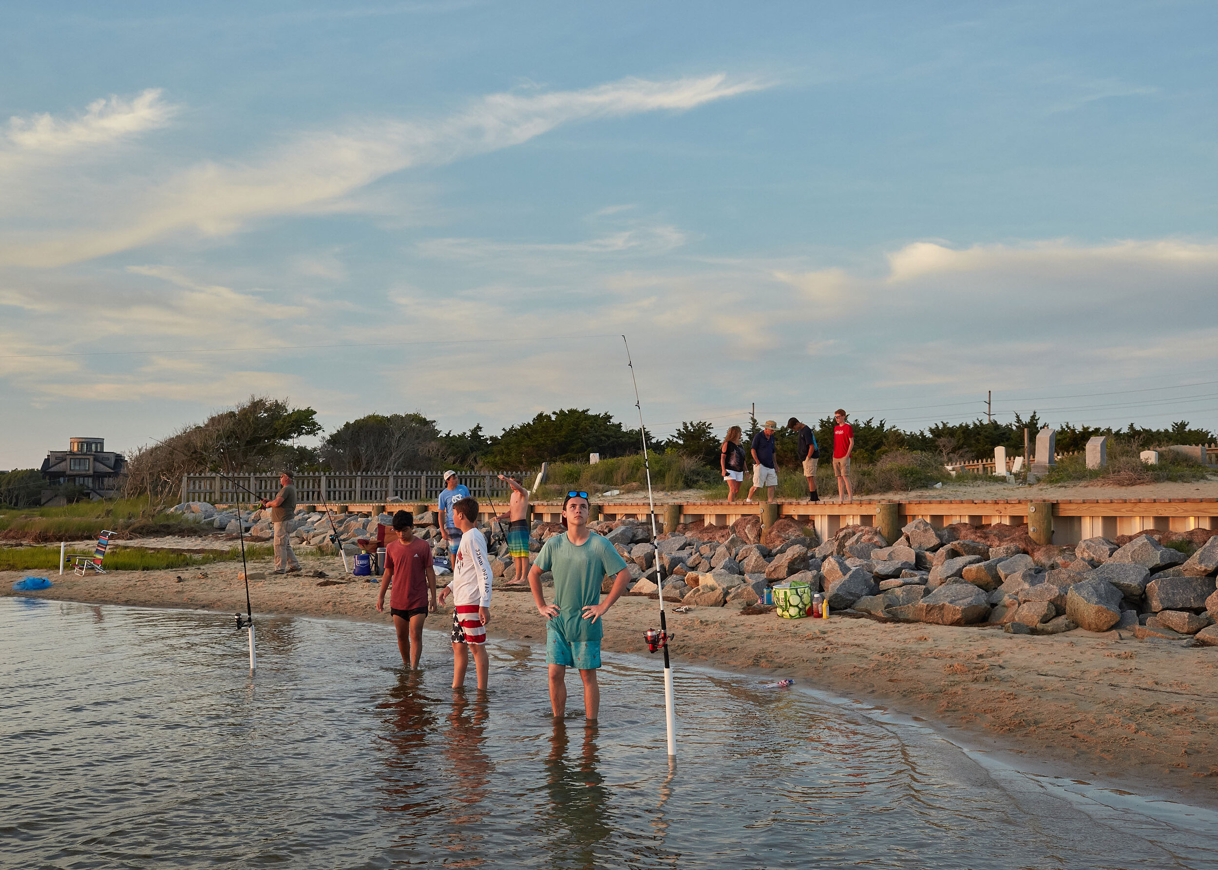  Tourists enjoy the sunset and the newly completed bulkhead at the Salvo Community Cemetery in May 2019. Dare County won a grant for $162,000 from funds left over from Hurricane Matthew emergency relief bill. Around 6pm on summer evenings, the Salvo 