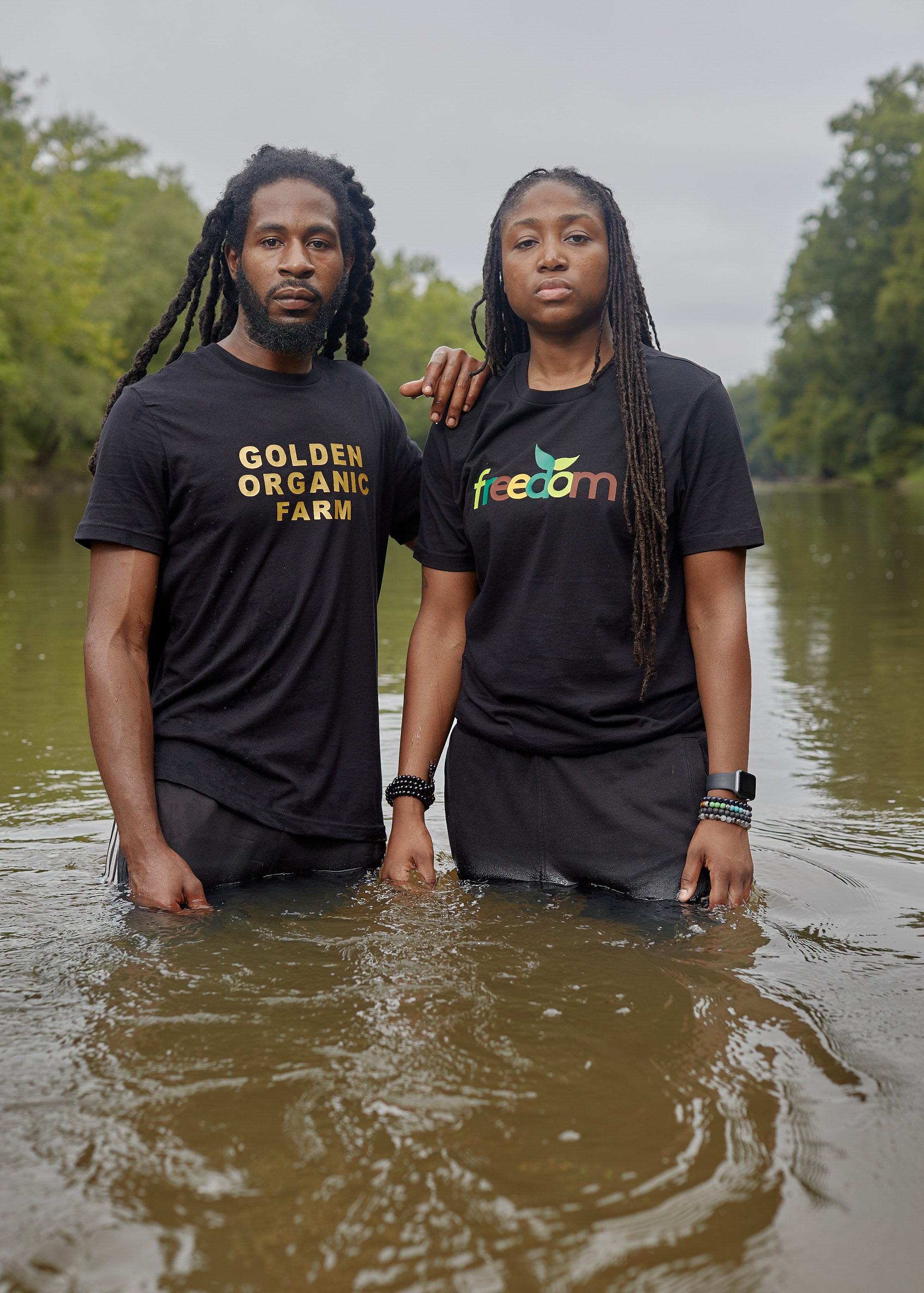  Kendrick Ransome and Marquetta Dickens in 2019 in the Tar River at Shiloh Landing, where enslaved Africans were brought ashore to be sold to plantations in Edgecombe County. Dickens and Ransome co-founded Freedom Org, Ransome runs Golden Organic Far