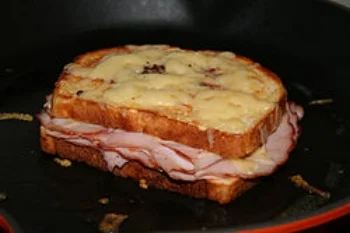 CROQUE MONSIEUR ( A TOASTED CHEESE AND HAM SANDWICH)