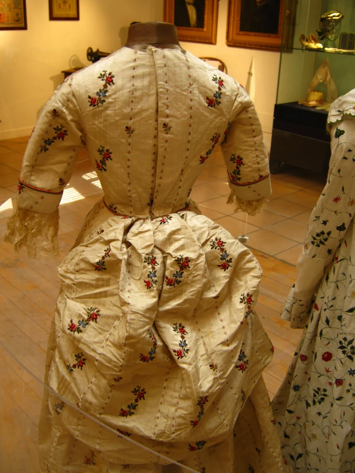 A SPITALFIELDS SILK DRESS WITH A POLONAISE BUSTLE