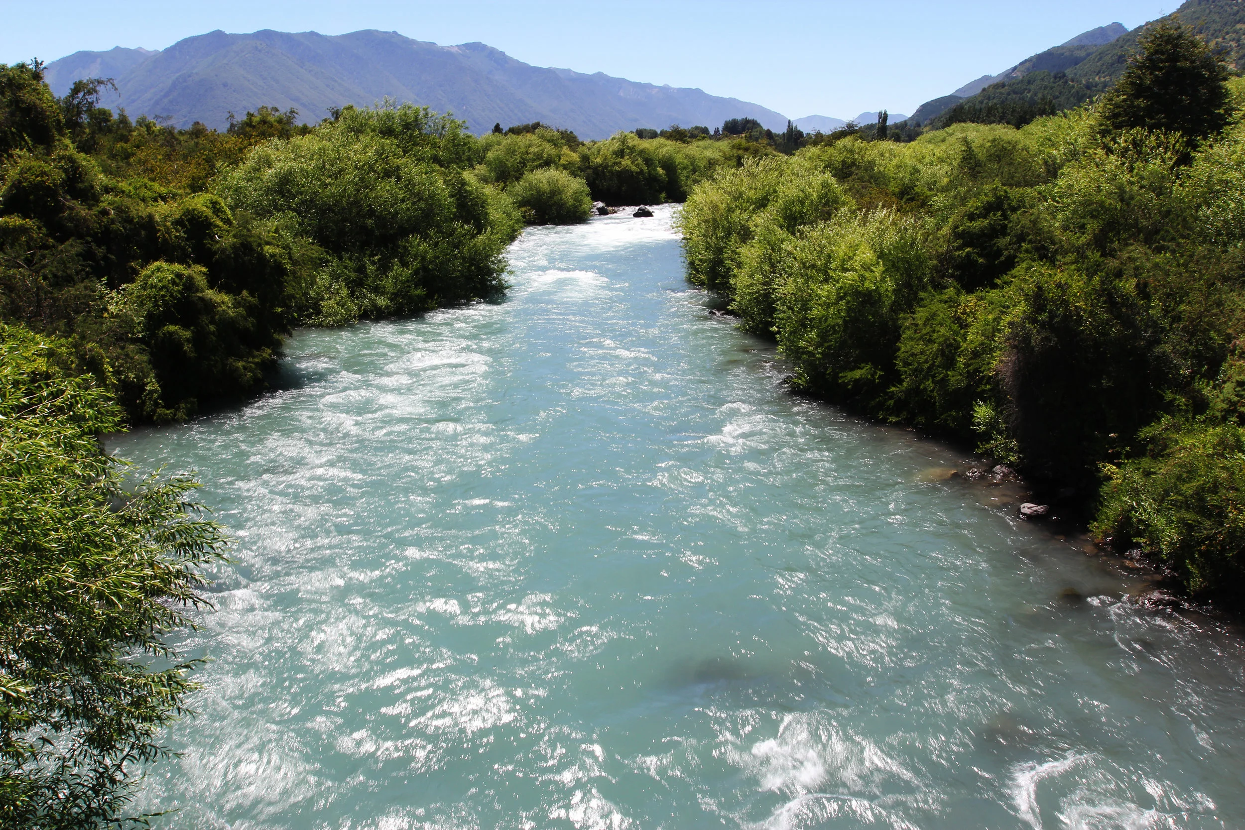 The icy waters of Allipén River in Melipeuco include snow melt from the eastern slope of Llaima. 
