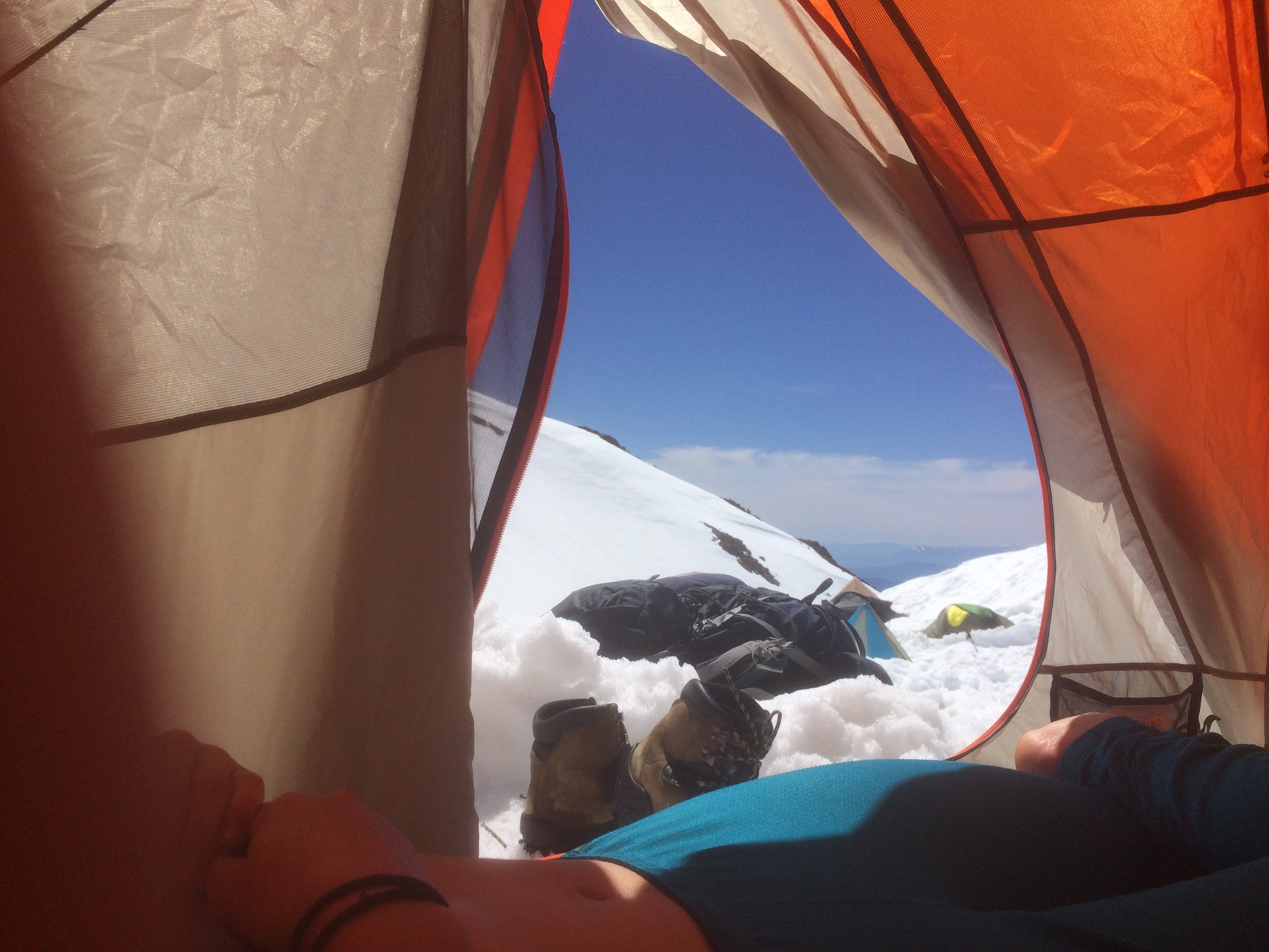 Hot and happy with the sun beating down on our creamsicle tent. 