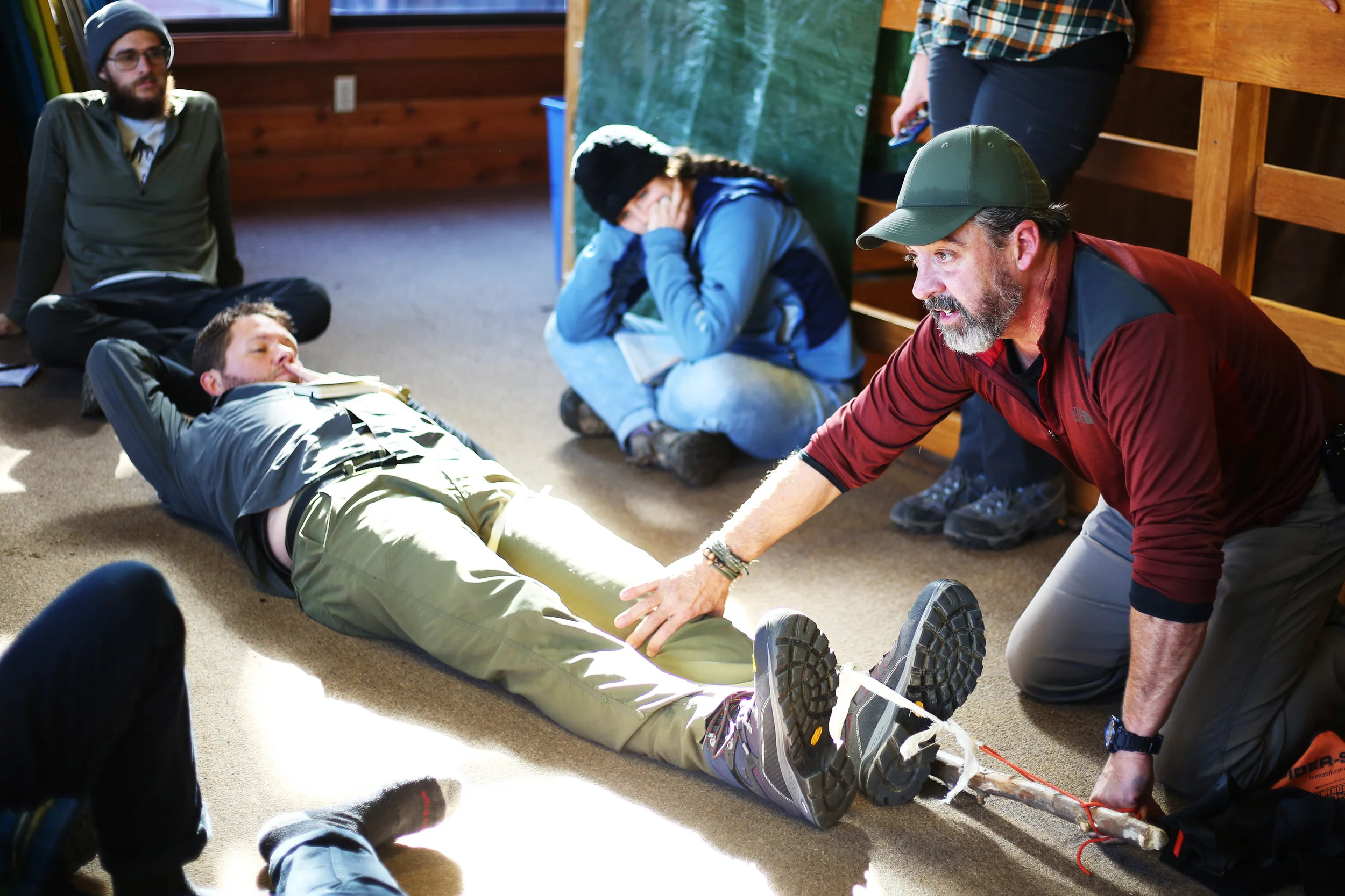 Conceptual physics meets backcountry. With Chad acting as the patient, Randy teaches us how to set a broken femur using a long tree branch and few pieces of rope.