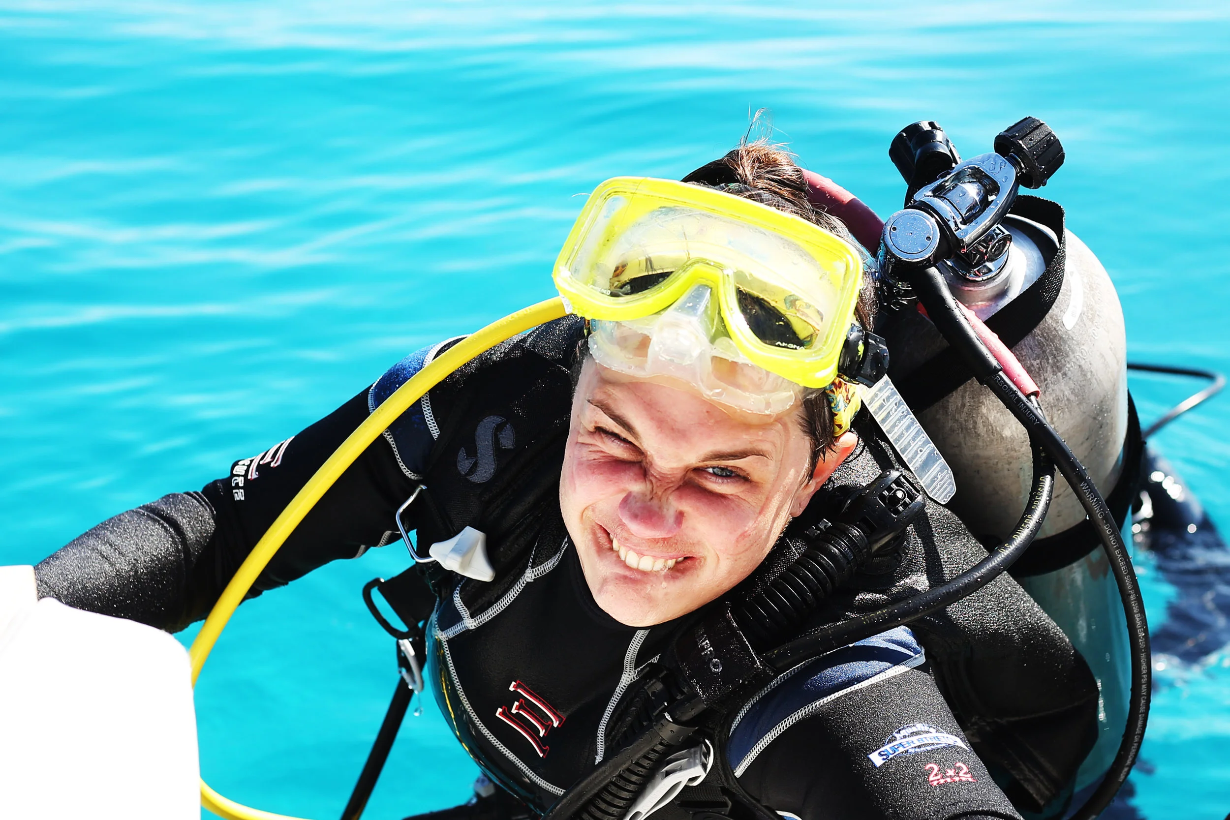 Kate Gould clambers out of the water after an hour of collecting and tagging corals near Key Largo, Florida | February 2019