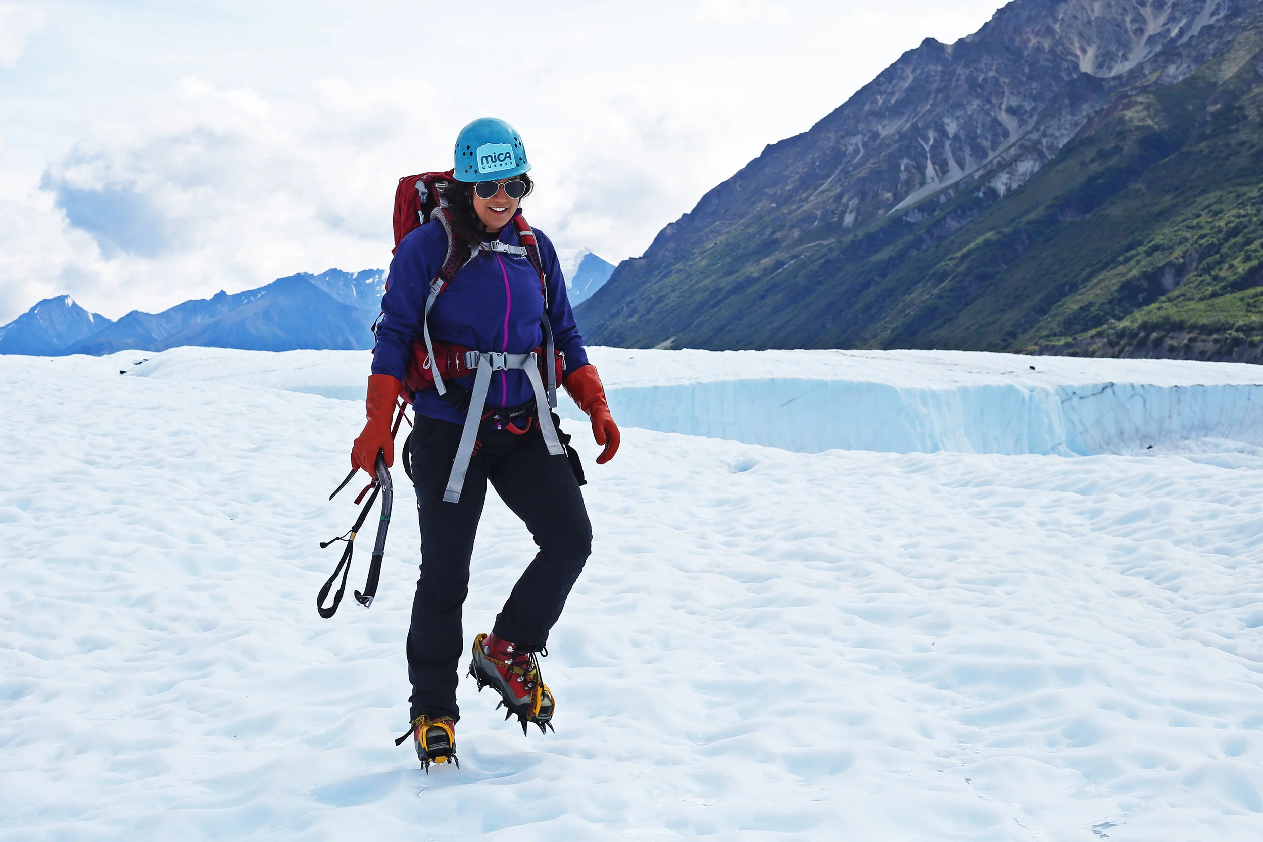 Britt gets used to walking in crampons.
