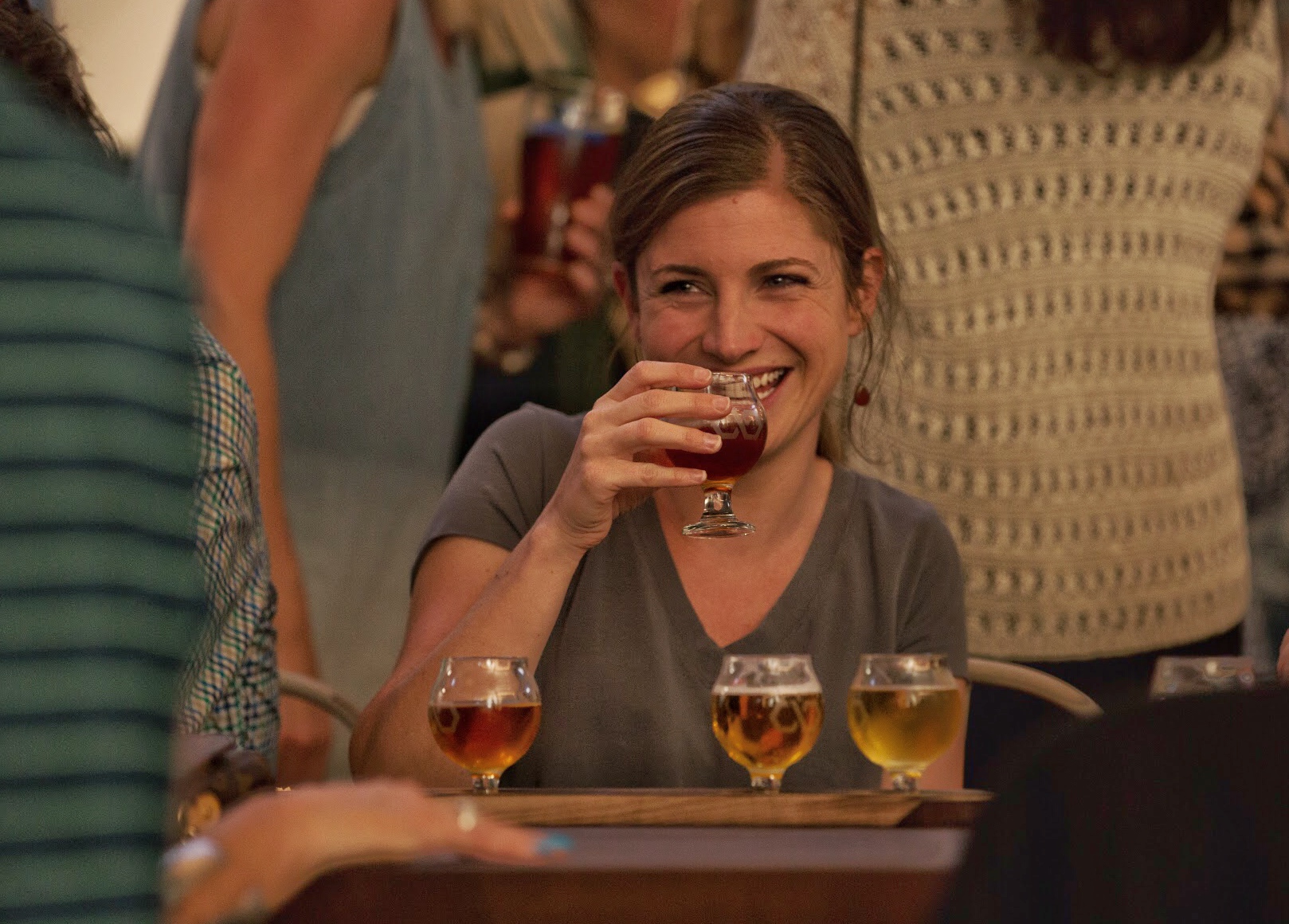 Smiling Person with Beer Flight