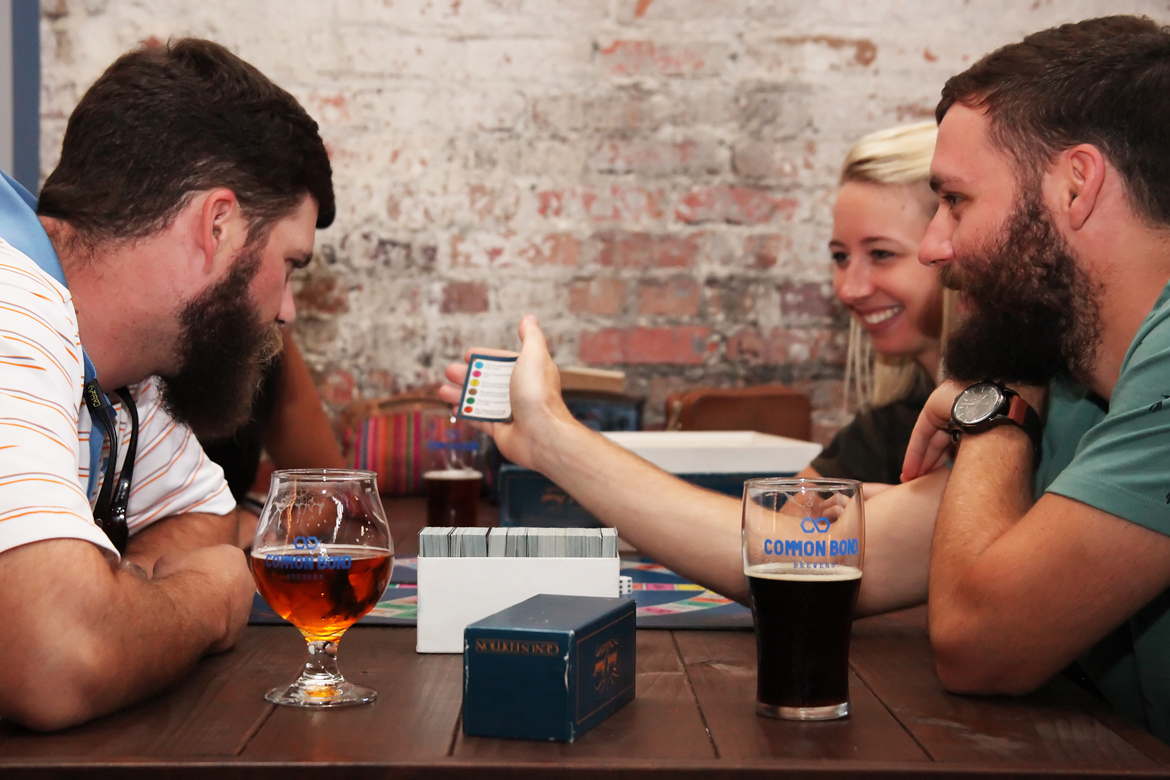 Group of friends drinking beer and playing games