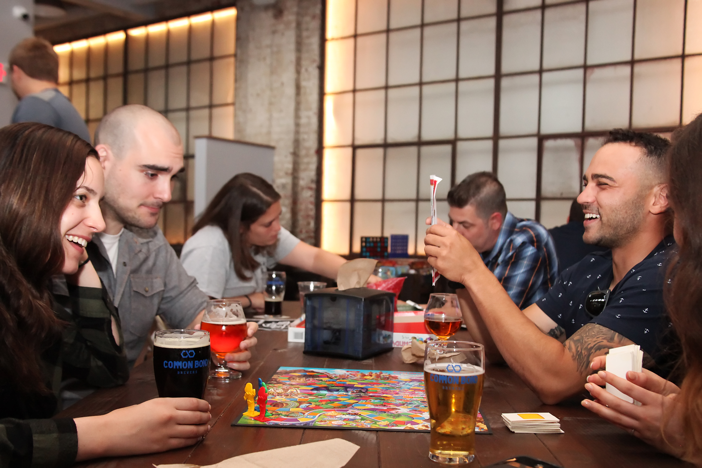 Group of friend drinking beer and playing board games