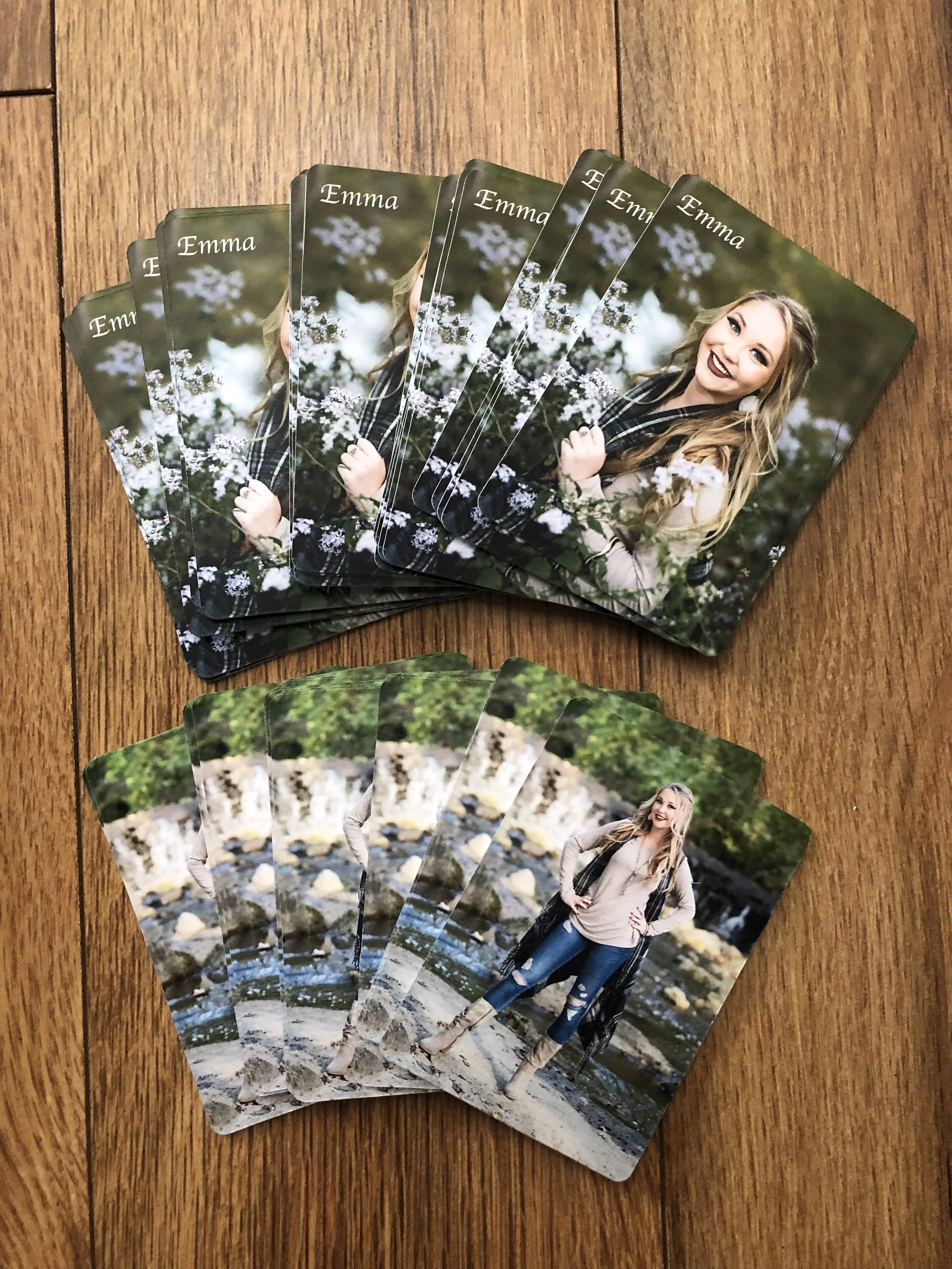 Double sided wallets can have names, year graduation or other words at the corner of any side. This particular photos we just did her name on one side. Double sided wallets come in sets of 50 only.