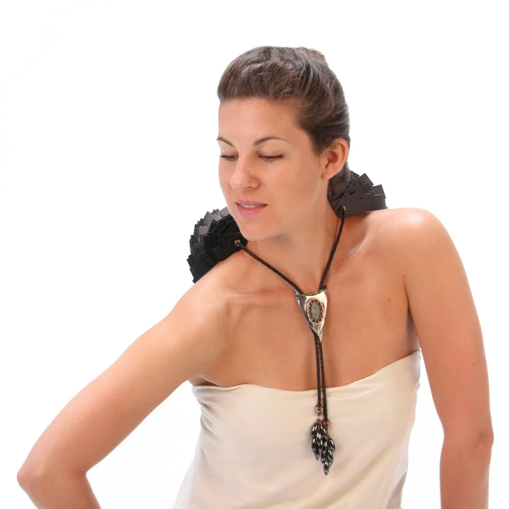 Apex en Vogue, paper made from recycled cotton clothing, recycled sterling, copper, moss aquamarine cabochon, freshwater pearls, various types of garnets. $2,900 Available to view by appointment only, at either location.