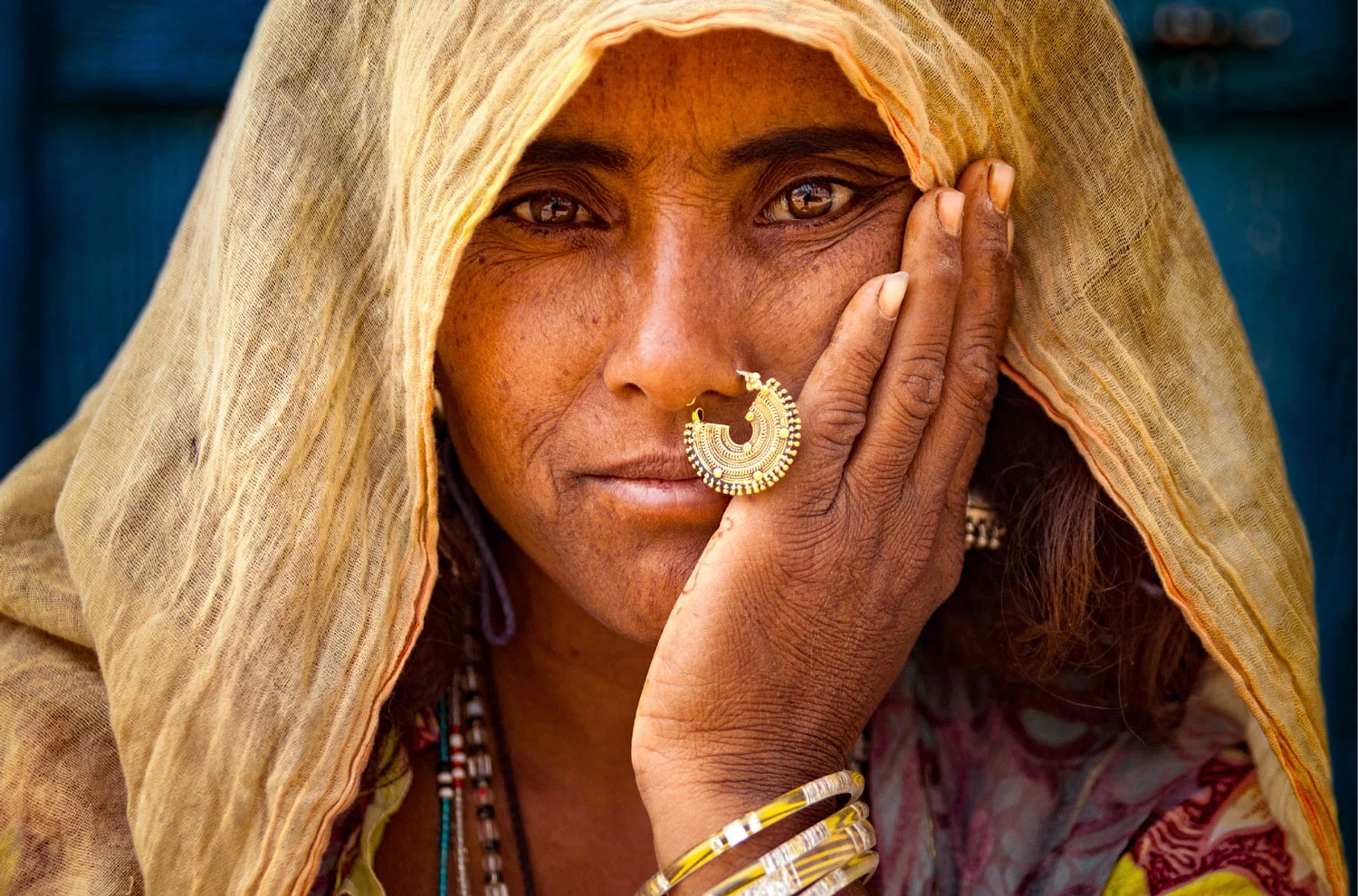 A Rajasthani woman wearing exquisite tribal jewelry