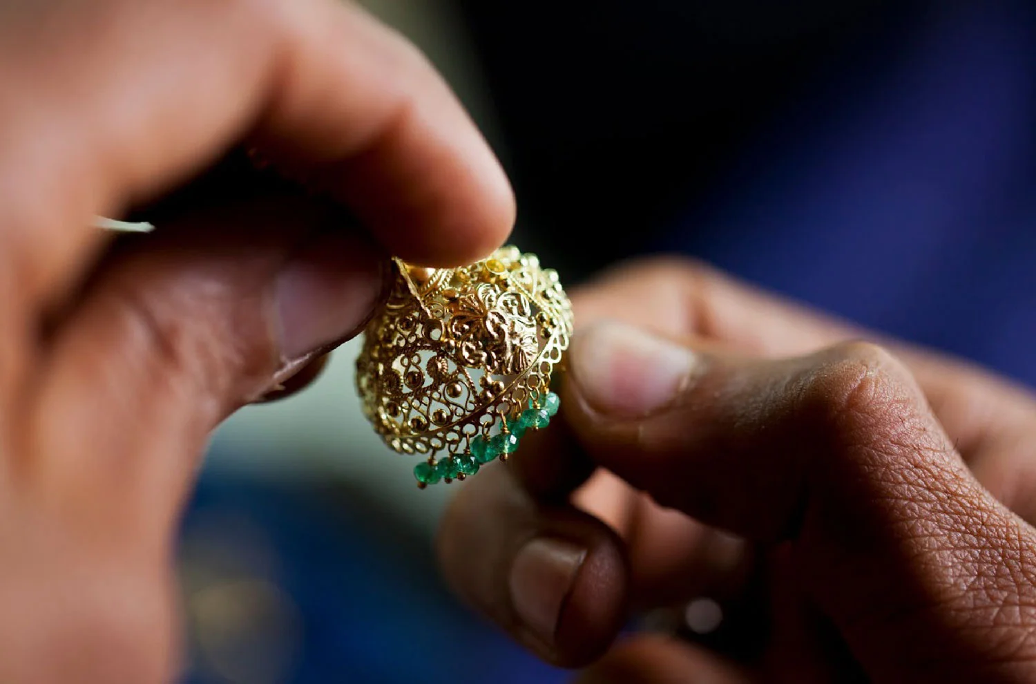 A goldsmith working on a traditional jhumka