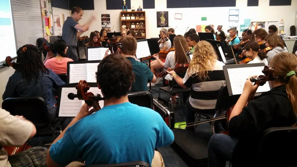 Conducting "The Swashbuckling Suite" with the Summit Middle School Orchestra.