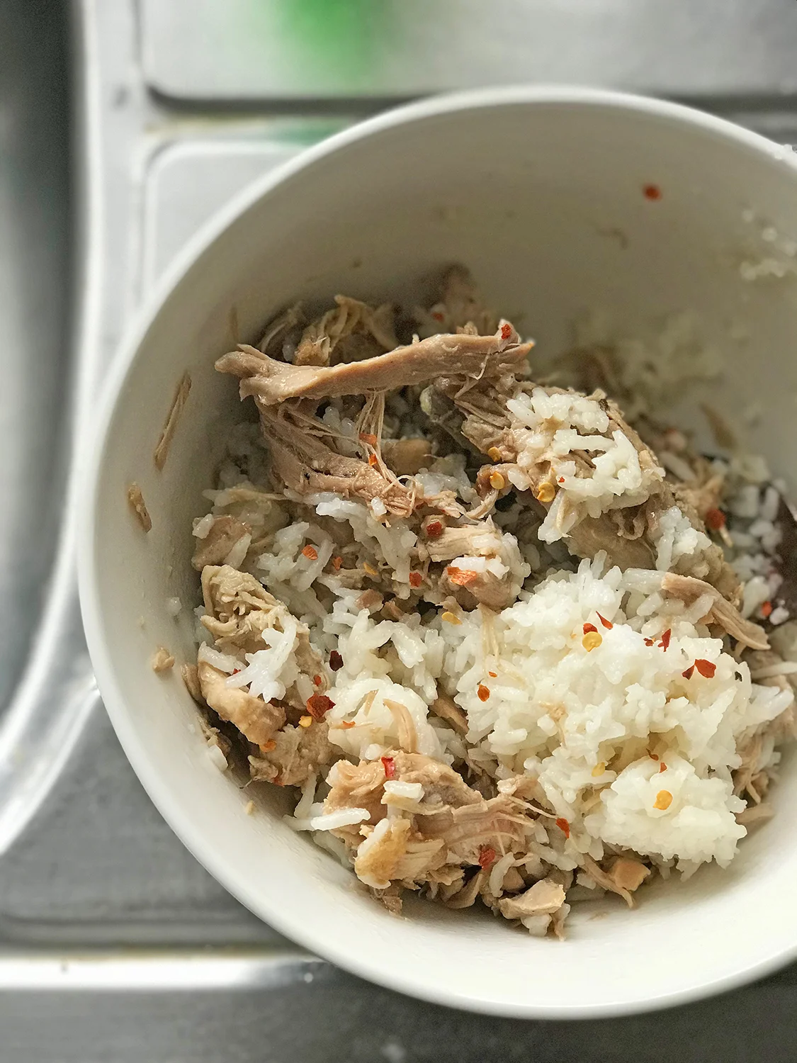 I would make a sizeable batch of adobo- a mix of chicken breasts and thighs cooked in apple cider vinegar and Kikkoman soy-sauce and nothing else, and would just take portions out for lunches and sometimes, for midnight snacks because why not?