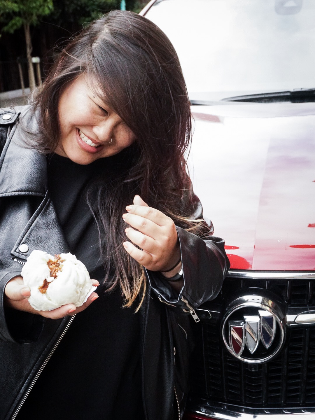 In front of Buick Enclave 2018 with Pork Bao