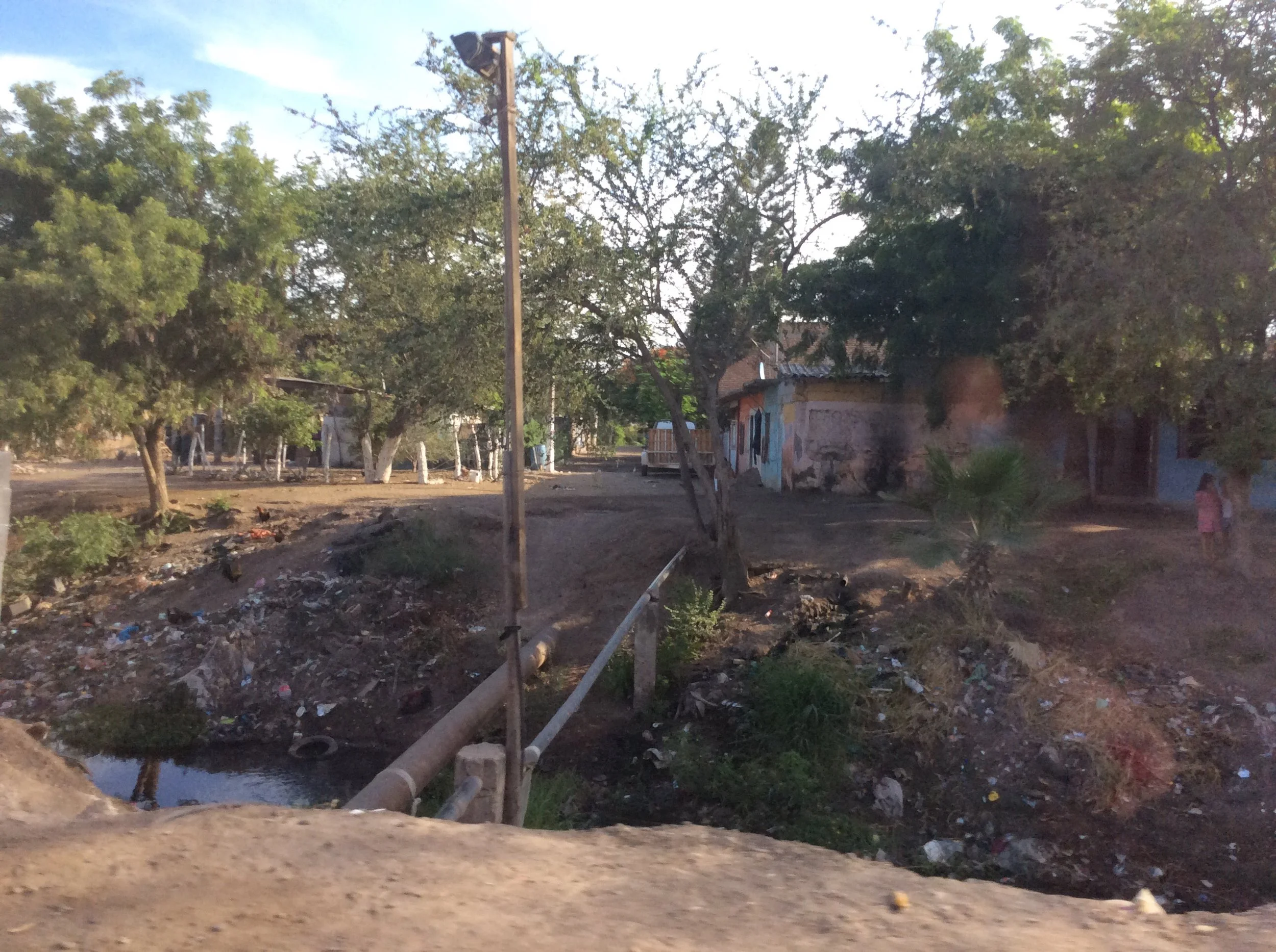 Limited access to garbage disposal forces residents of Villa Juárez to burn garbage or dump it in the canal. (Photo: Savannah Crowley)